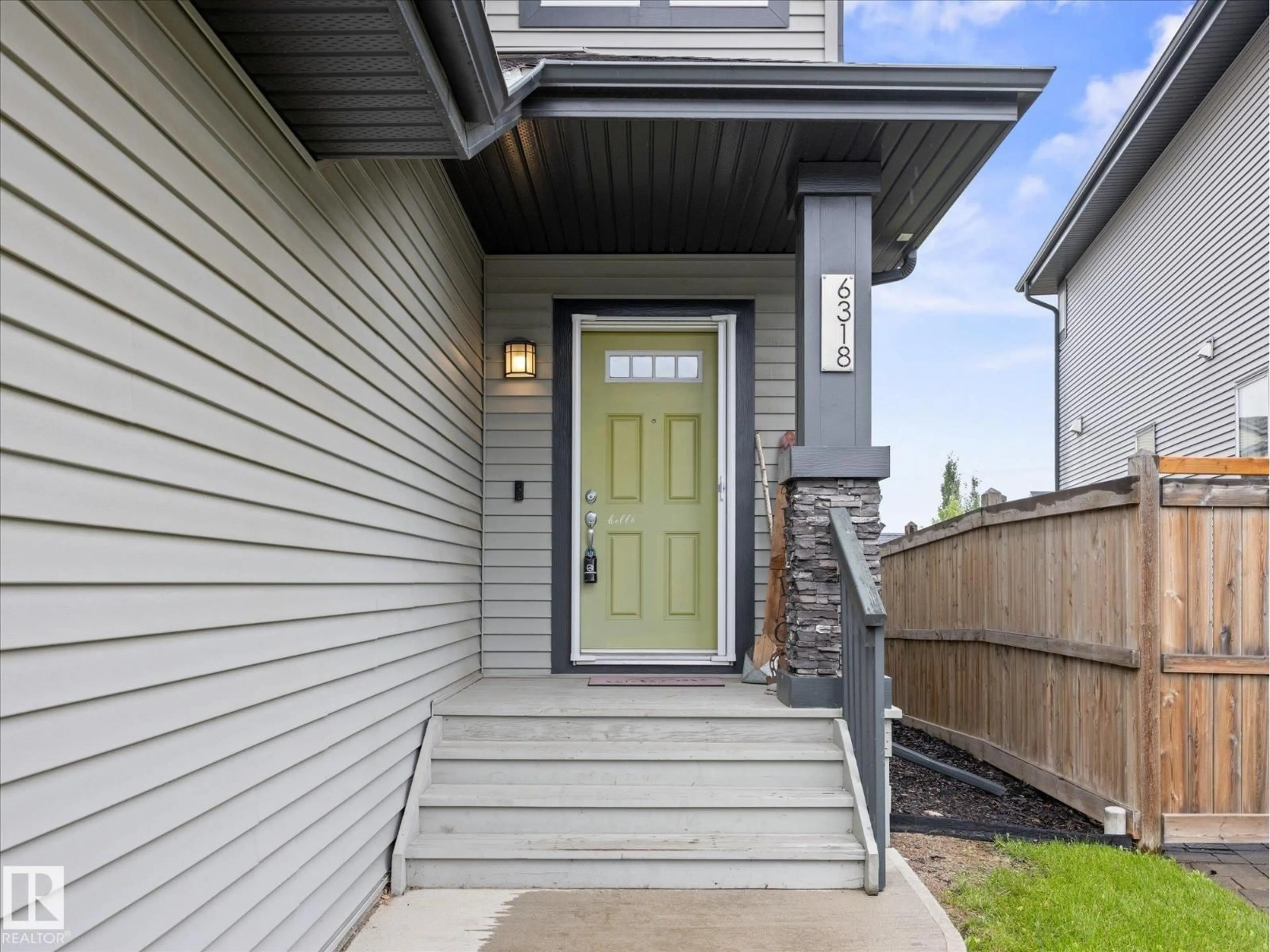 Home with vinyl exterior material, street for 6318 167A AV, Edmonton Alberta T5Y3P7