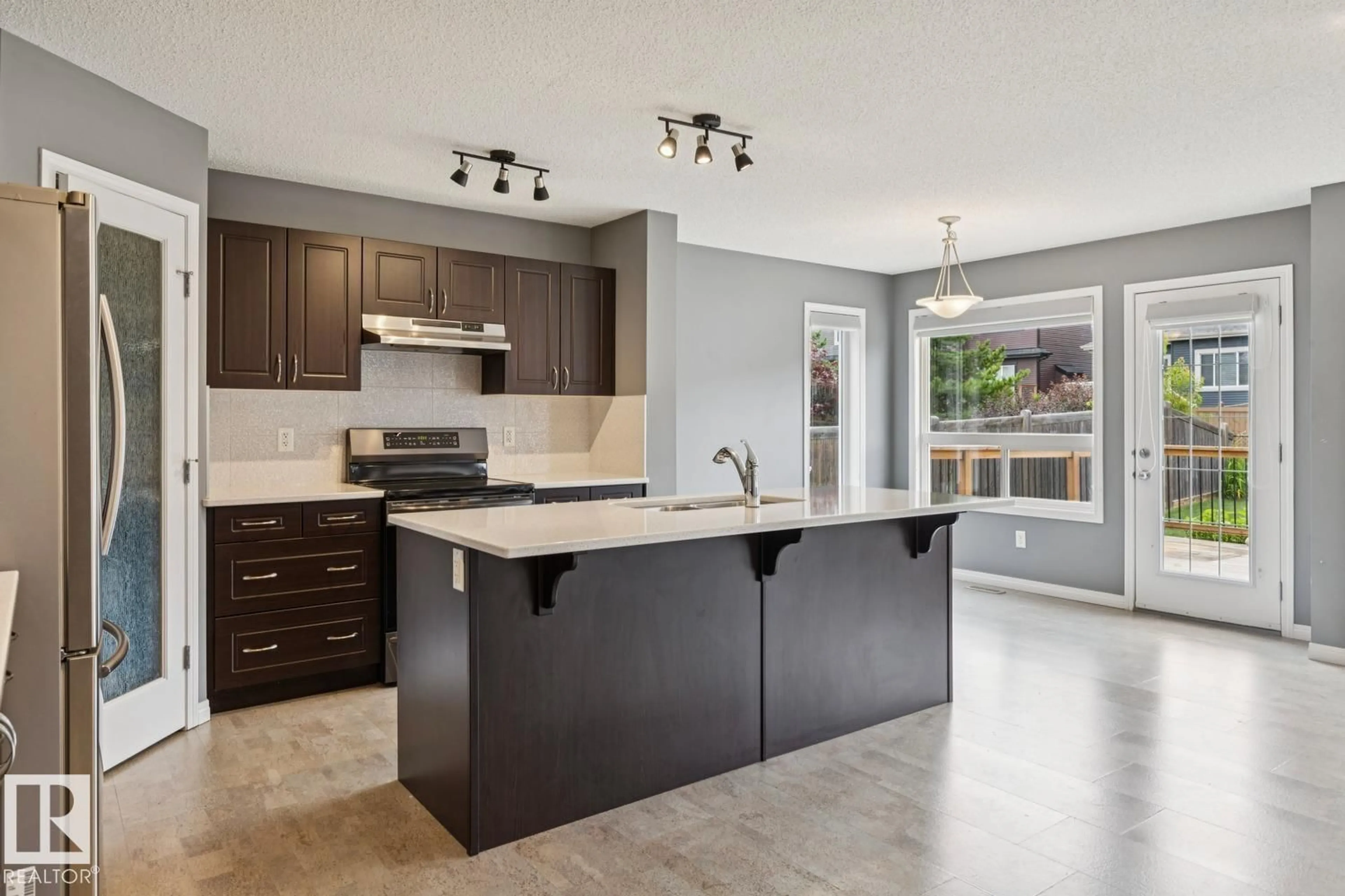 Open concept kitchen, ceramic/tile floor for 5935 18 AV, Edmonton Alberta T6X0W4