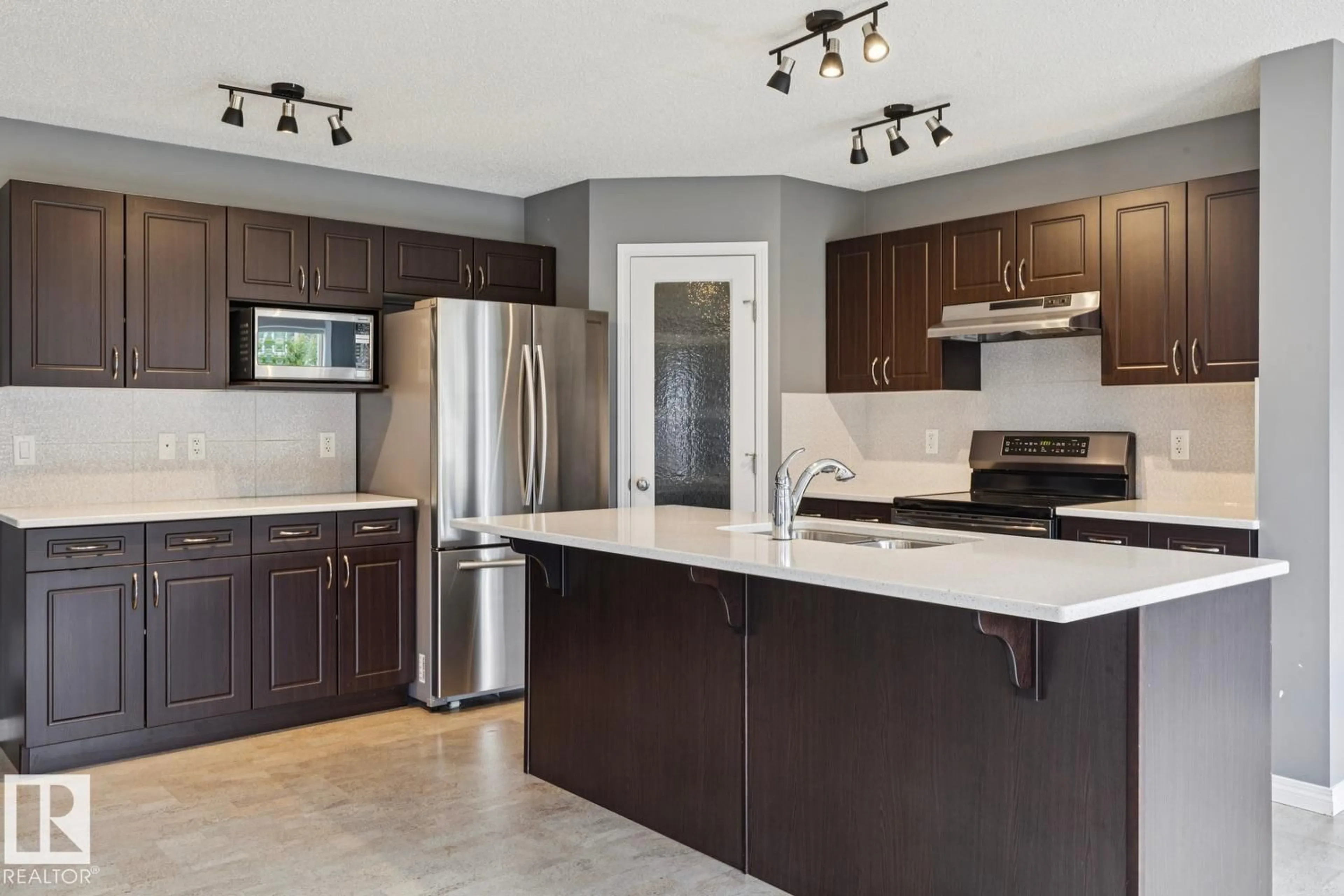 Open concept kitchen, ceramic/tile floor for 5935 18 AV, Edmonton Alberta T6X0W4