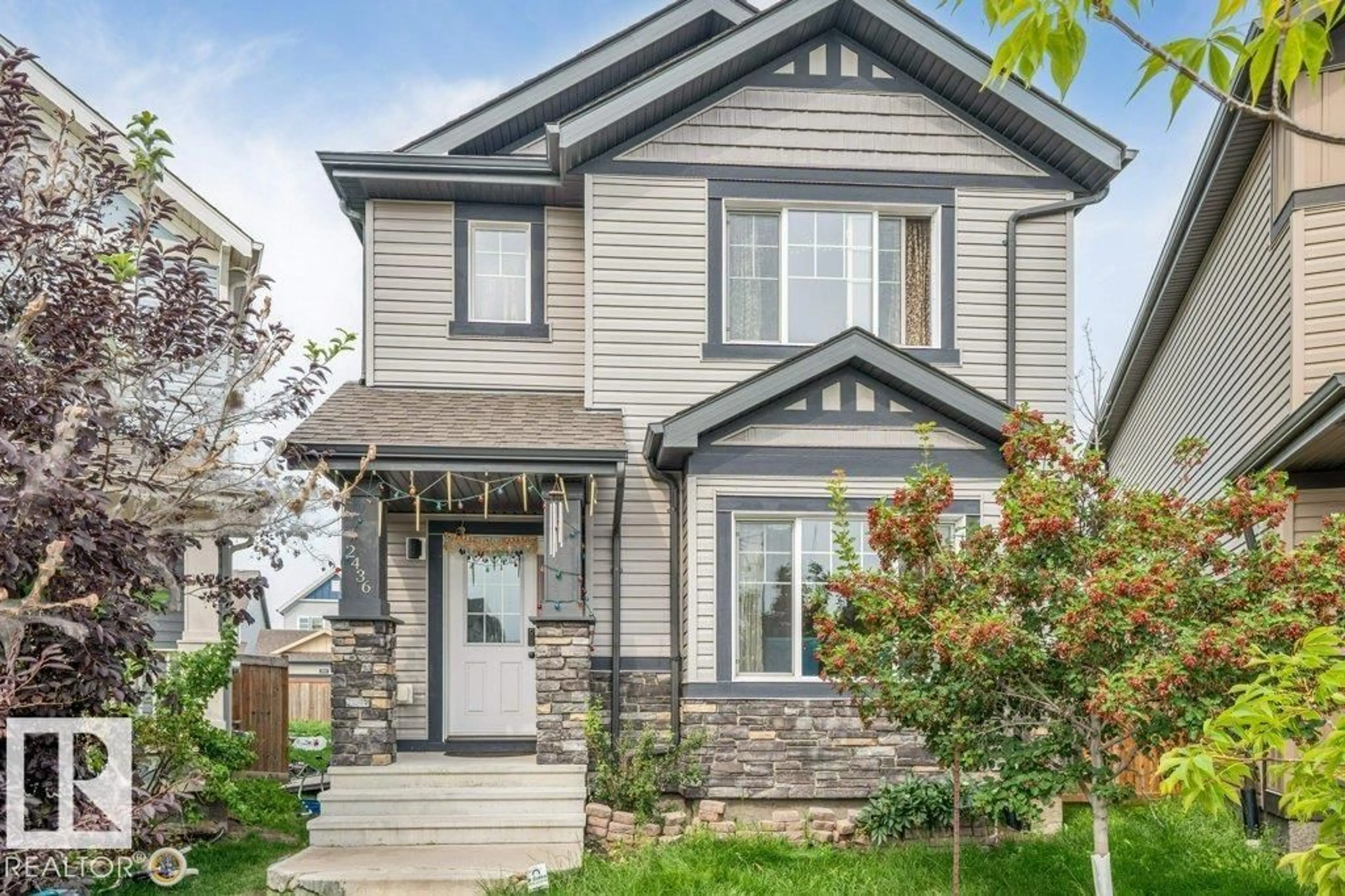 Home with vinyl exterior material, street for 2436 18 AV, Edmonton Alberta T6T2G7