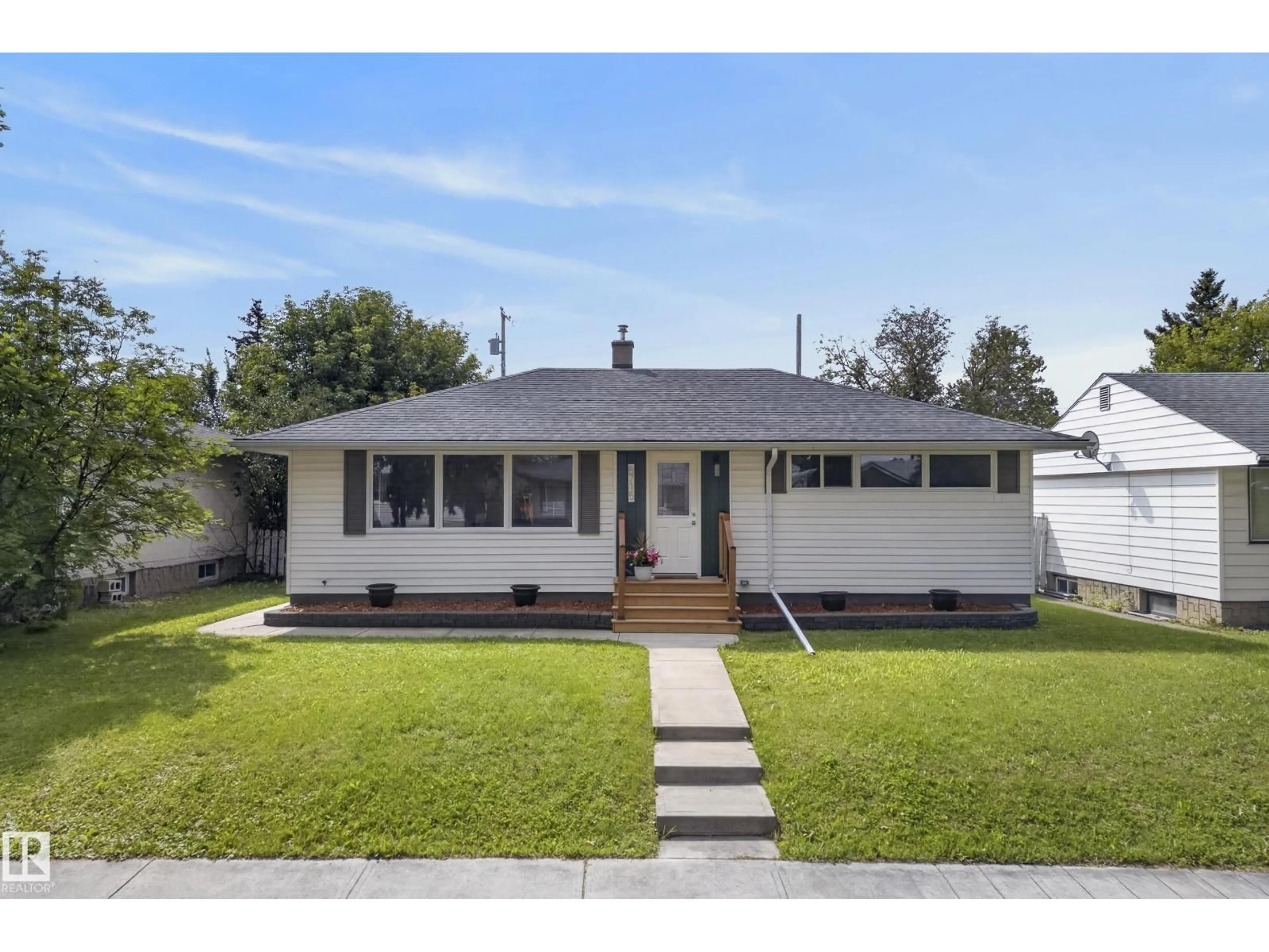 Home with vinyl exterior material, street for 8715 64 AV, Edmonton Alberta T6E0H4
