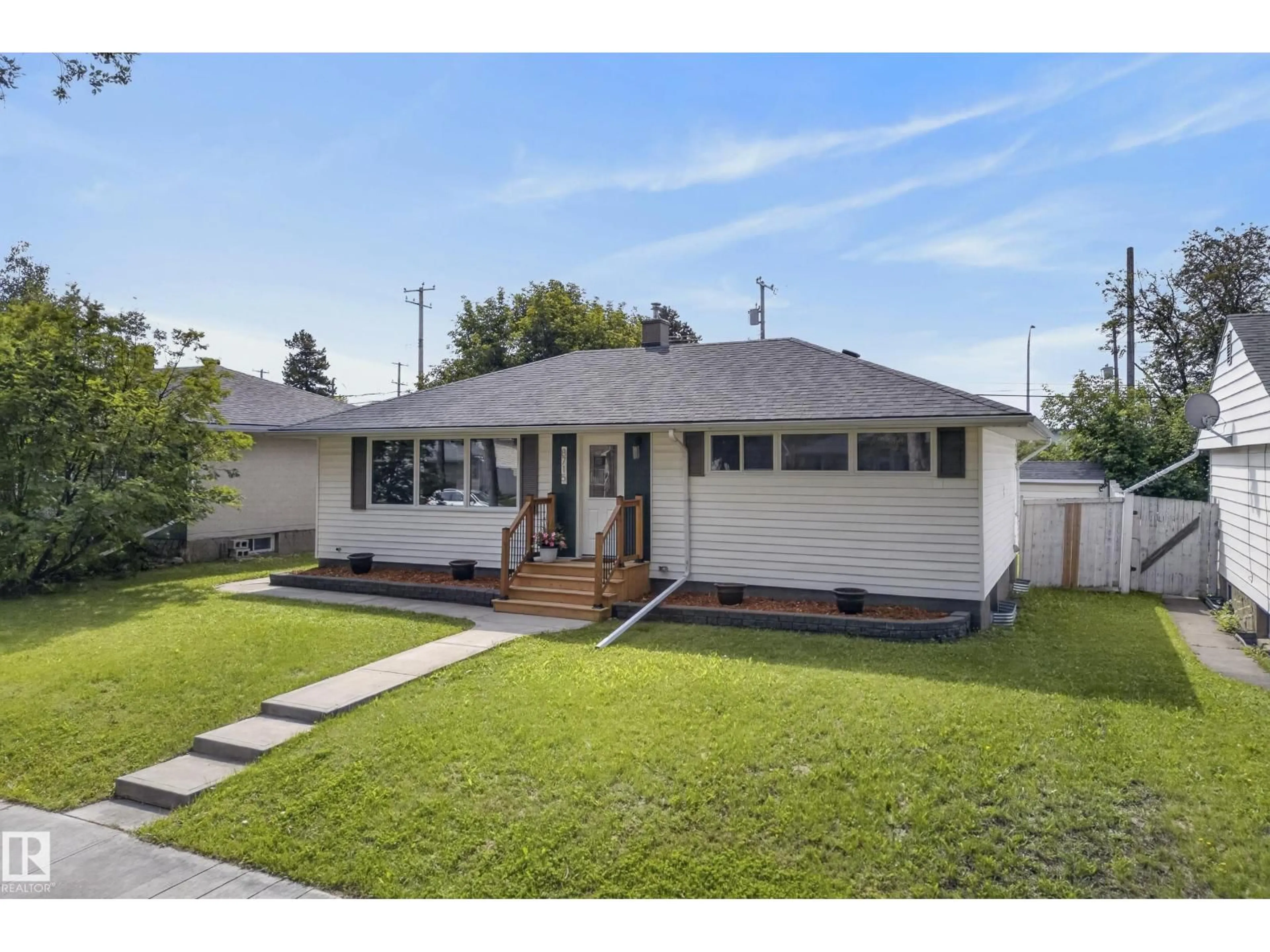 Home with vinyl exterior material, street for 8715 64 AV, Edmonton Alberta T6E0H4