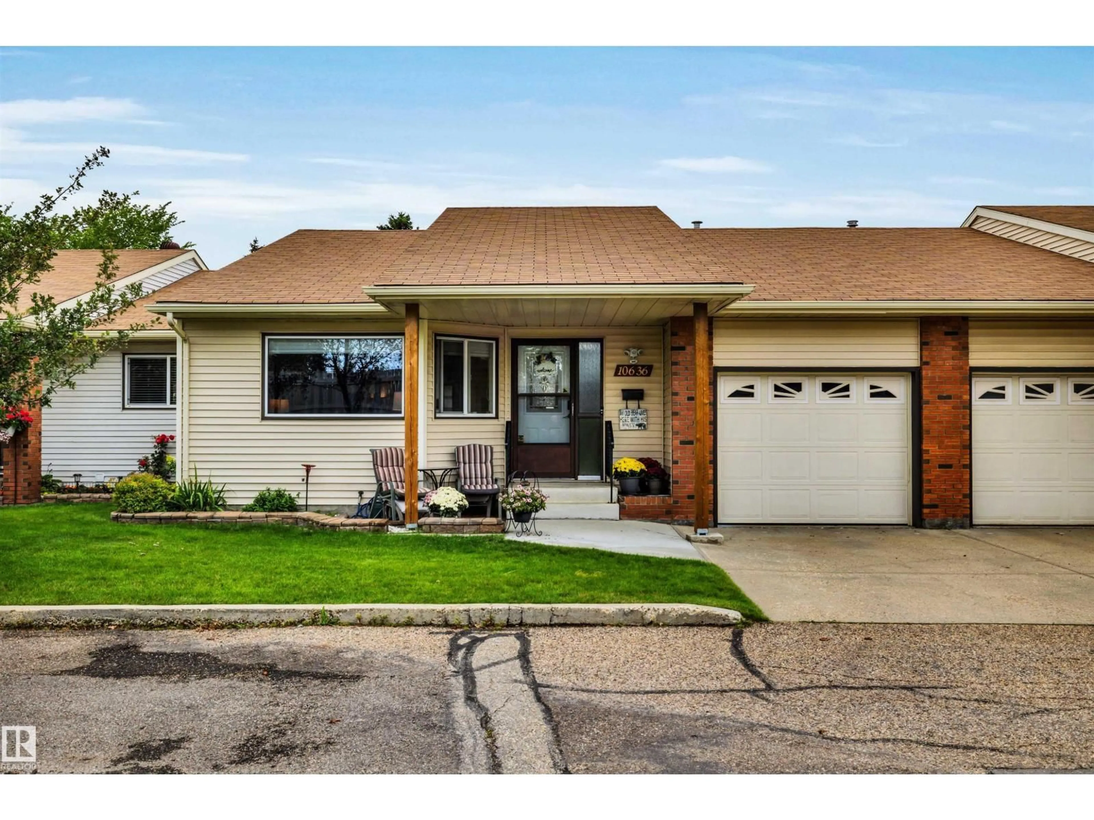 Home with vinyl exterior material, street for NW - 10636 153 AV, Edmonton Alberta T5X5R5