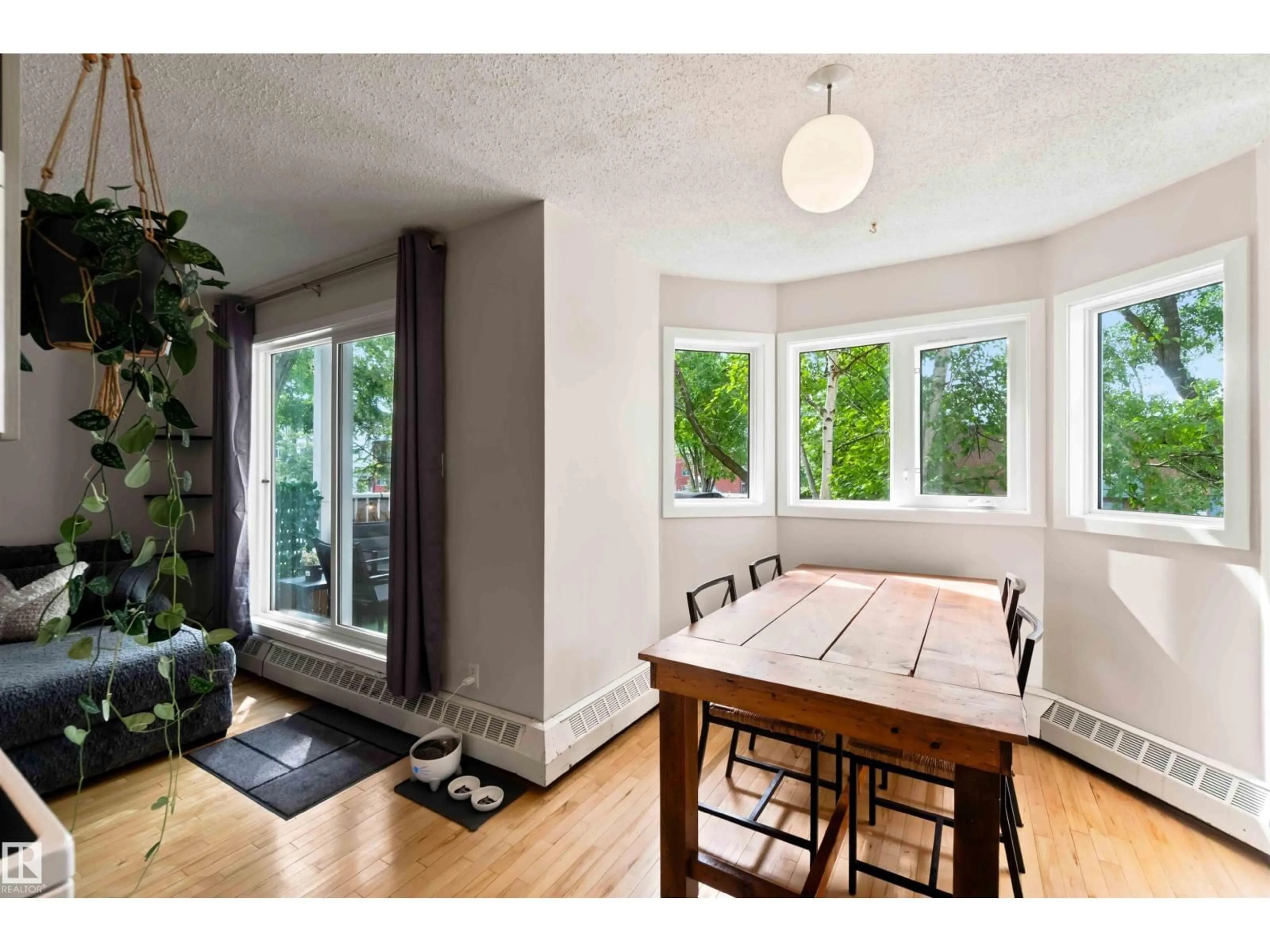 Dining room, wood/laminate floor for #201 - 10504 77 AV, Edmonton Alberta T6E1N1