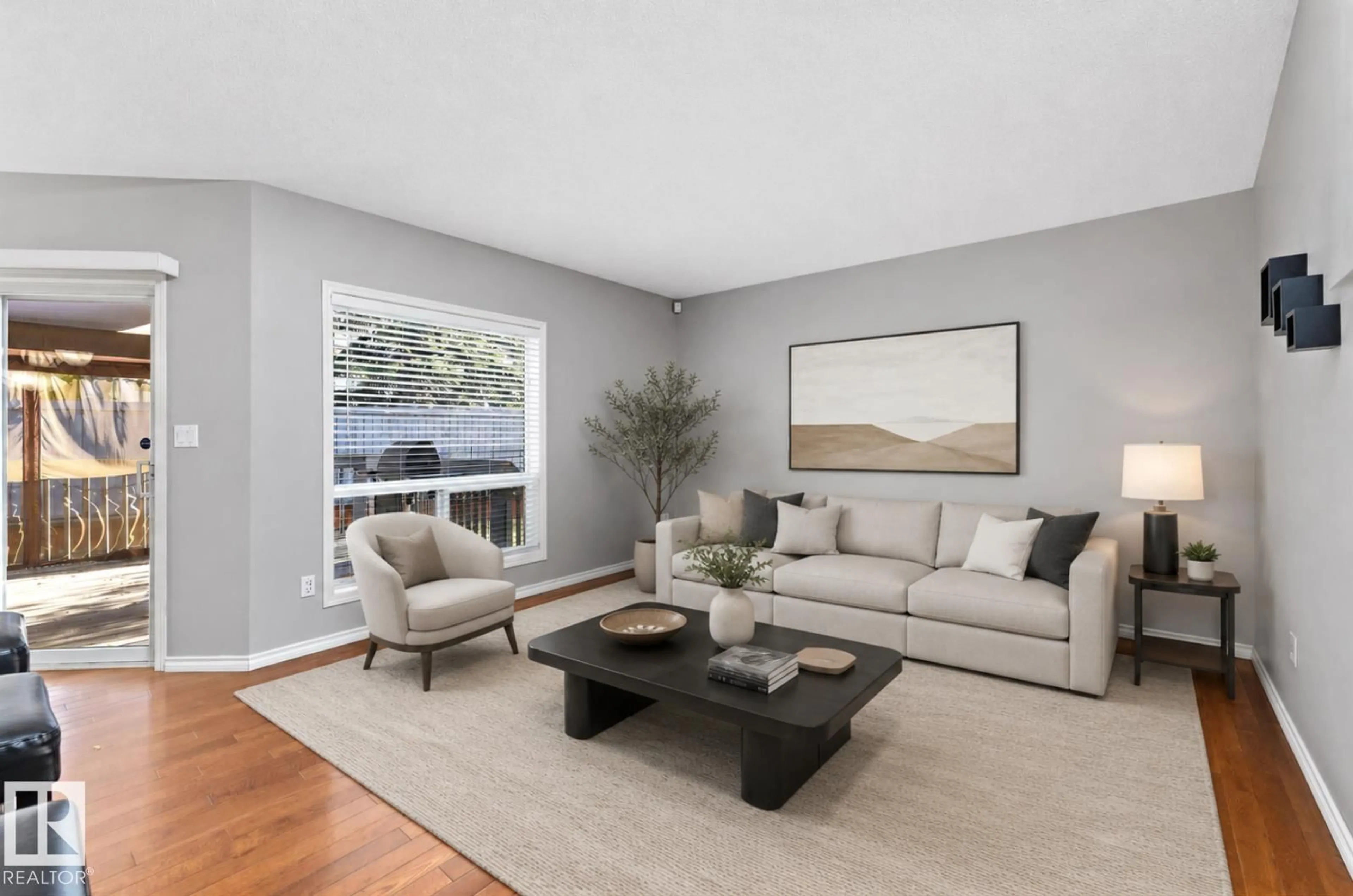 Living room with furniture, wood/laminate floor for 215 - 123 BLACKBURN DR, Edmonton Alberta T6W1B9