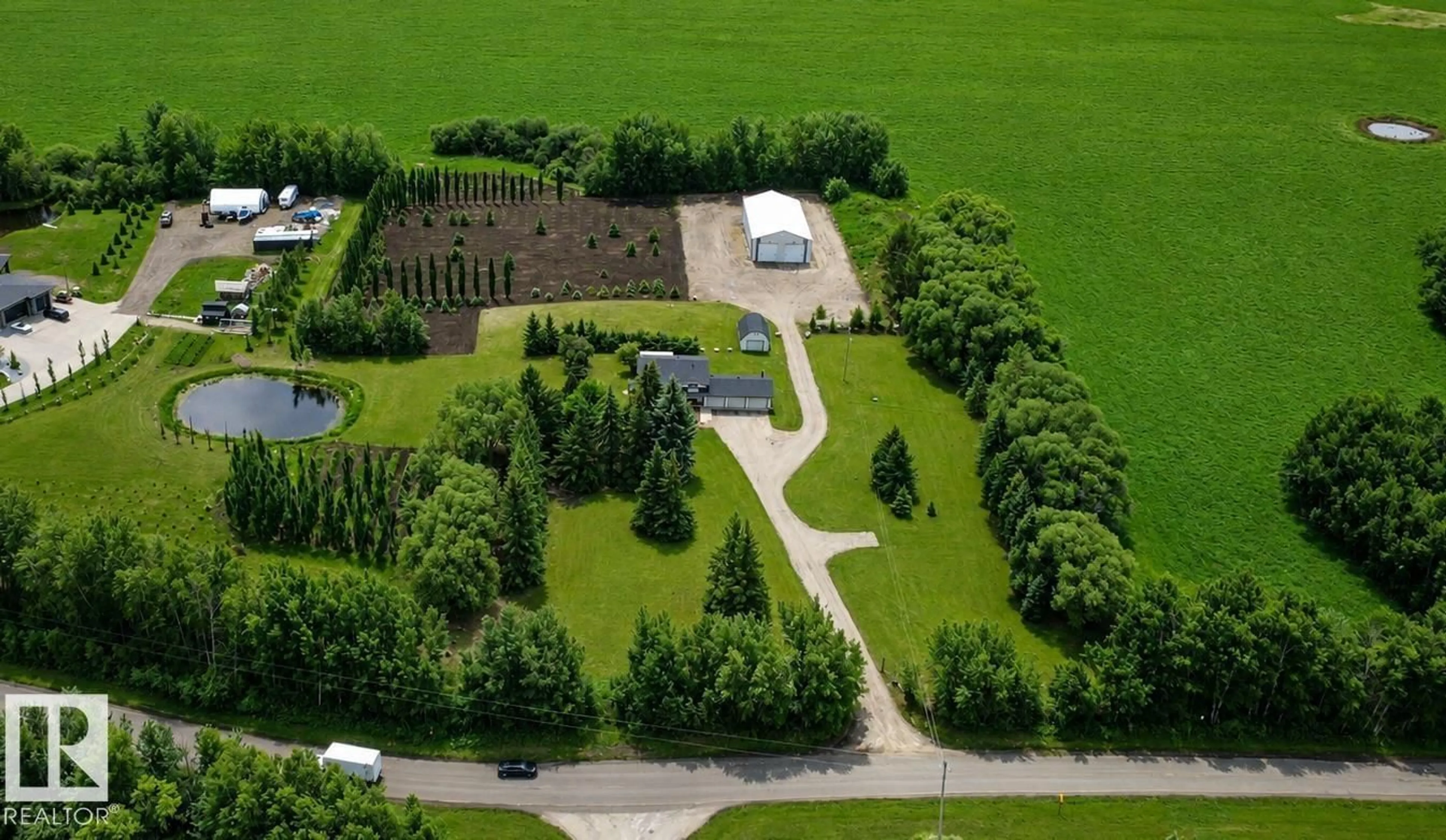 A pic from outside/outdoor area/front of a property/back of a property/a pic from drone, street for 27309 TWP ROAD 534, Rural Parkland County Alberta T7X3S1