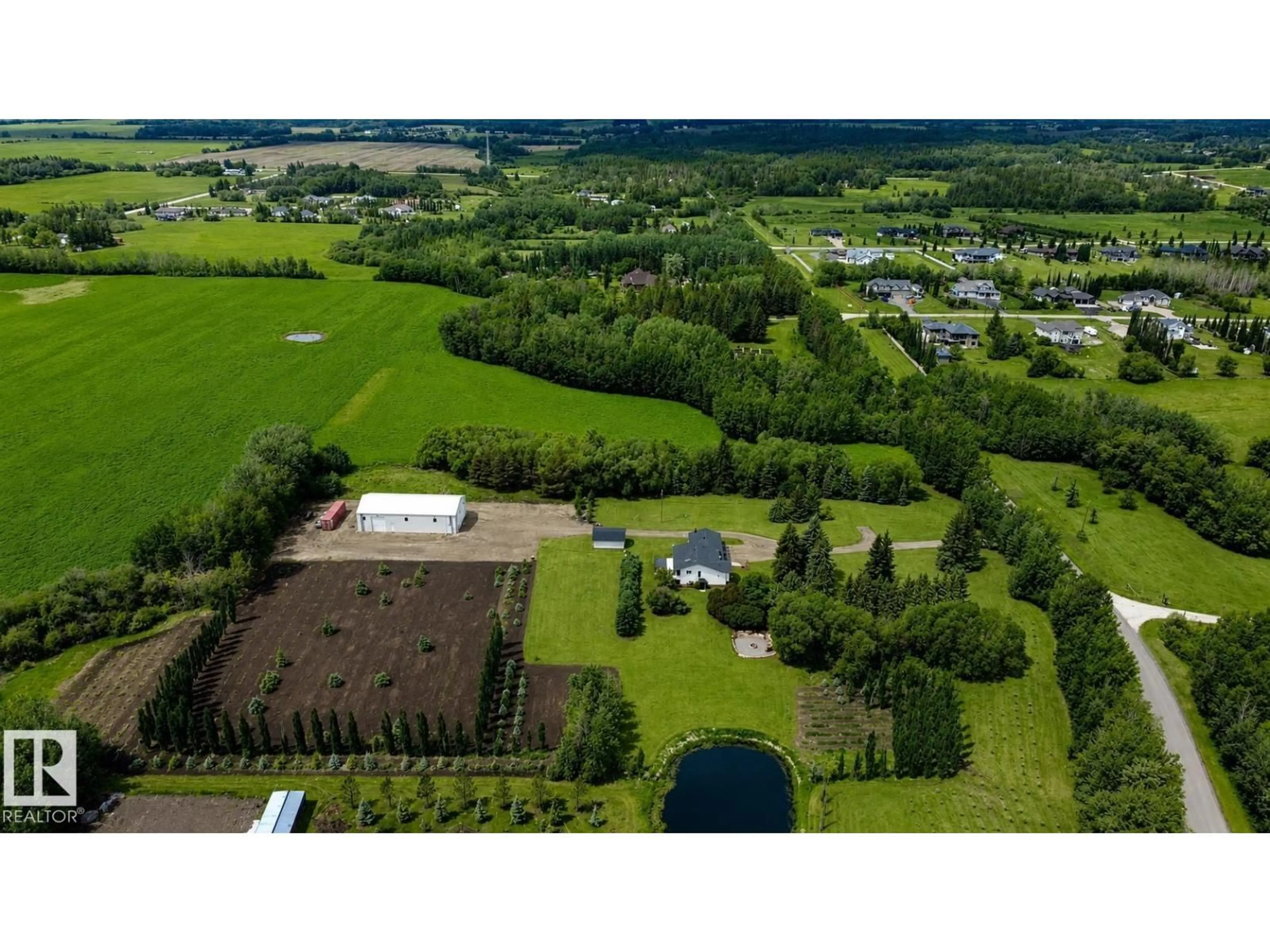 A pic from outside/outdoor area/front of a property/back of a property/a pic from drone, unknown for 27309 TWP ROAD 534, Rural Parkland County Alberta T7X3S1