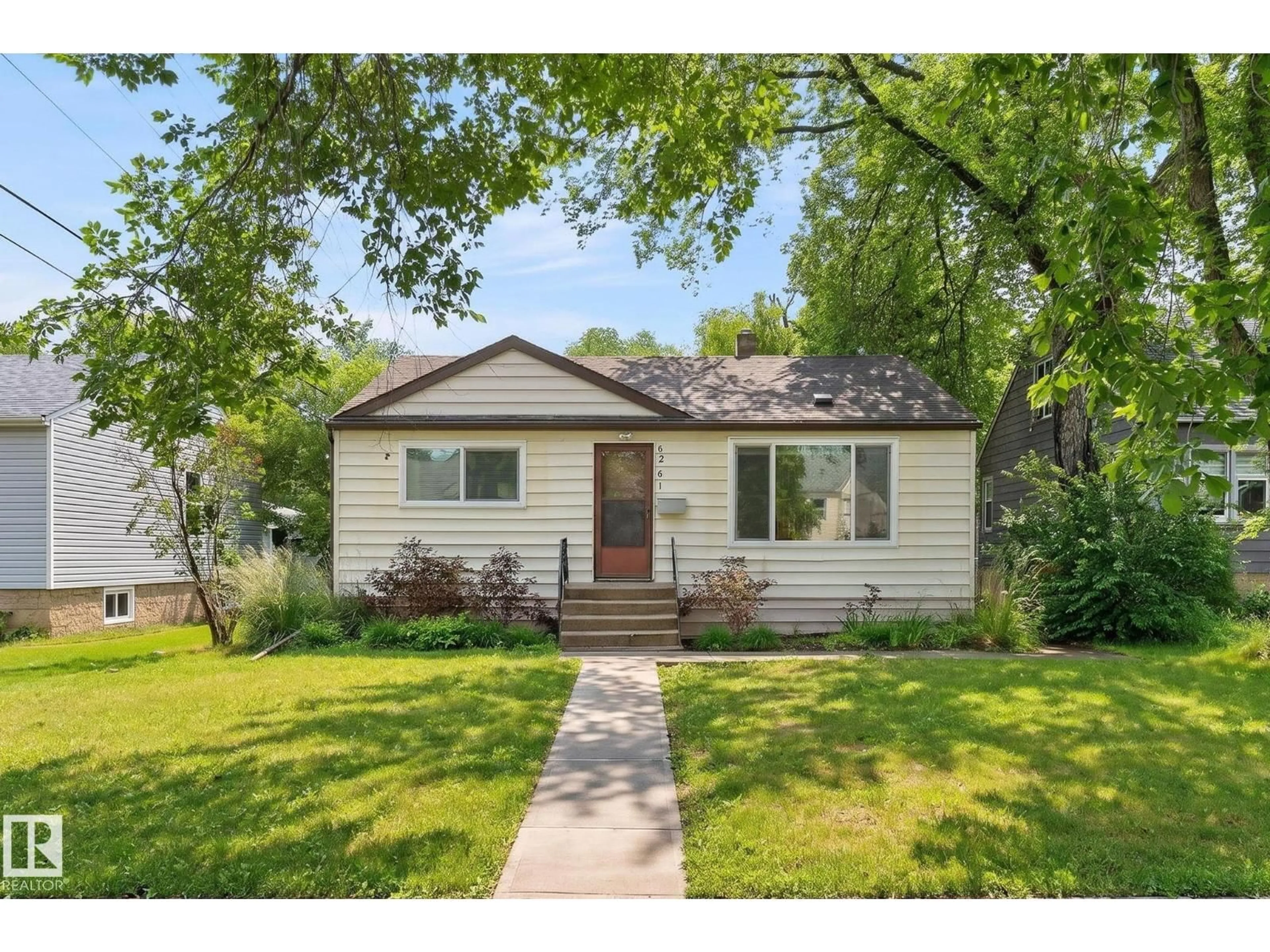 Home with vinyl exterior material, street for NW - 6261 112A ST, Edmonton Alberta T6H3K4