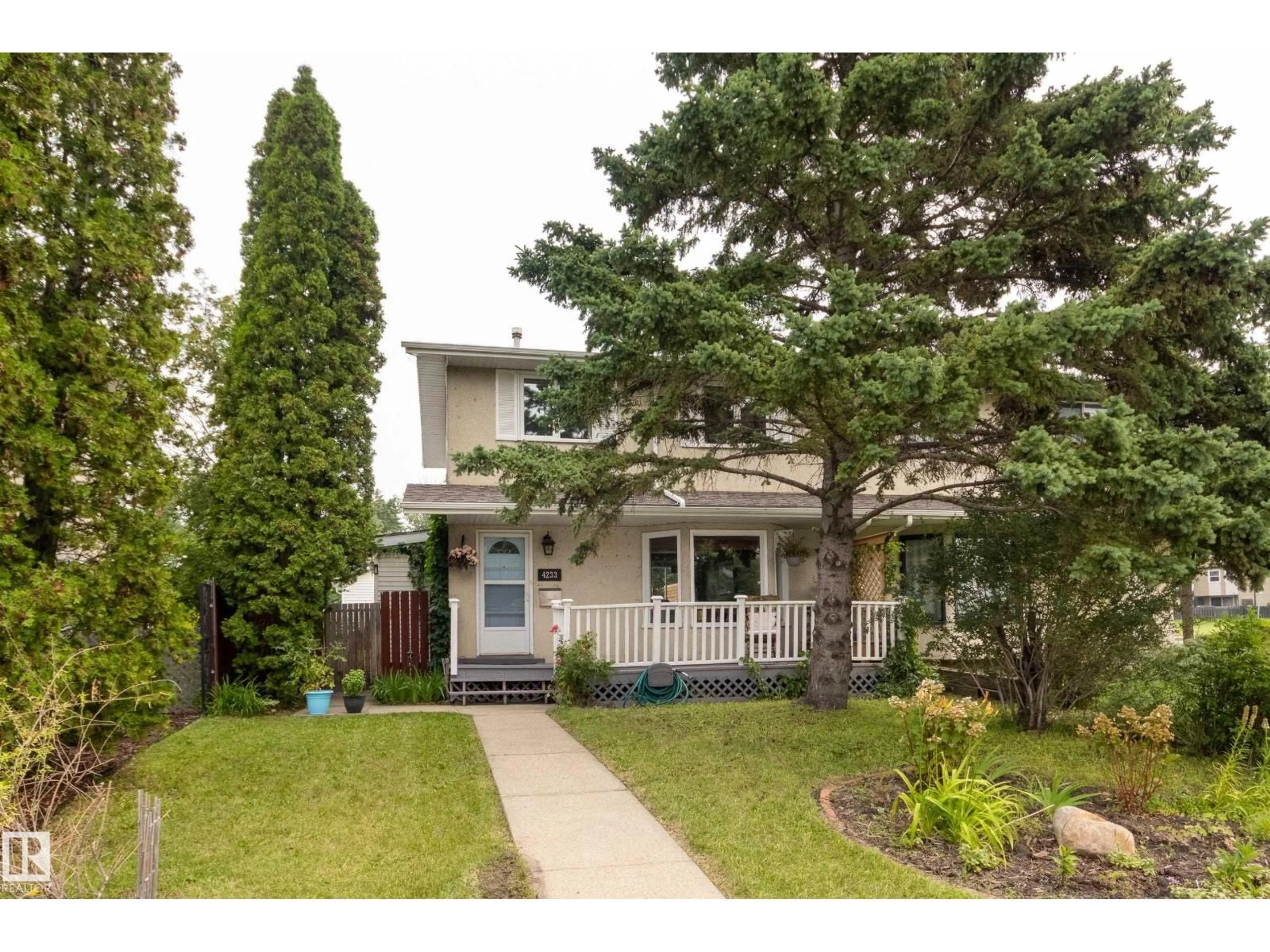 Home with vinyl exterior material, street for NW - 4233 85 ST, Edmonton Alberta T6K1B3