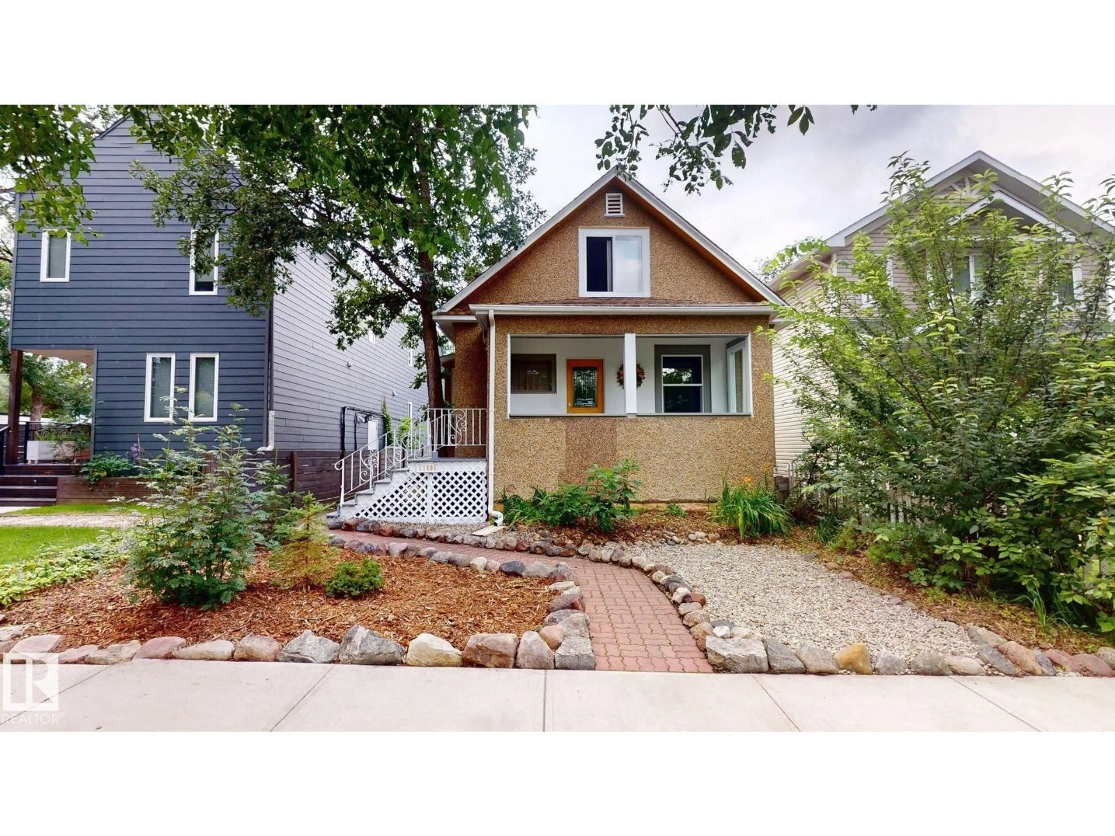 Home with brick exterior material, street for NW - 11406 66 ST, Edmonton Alberta T5B1H8