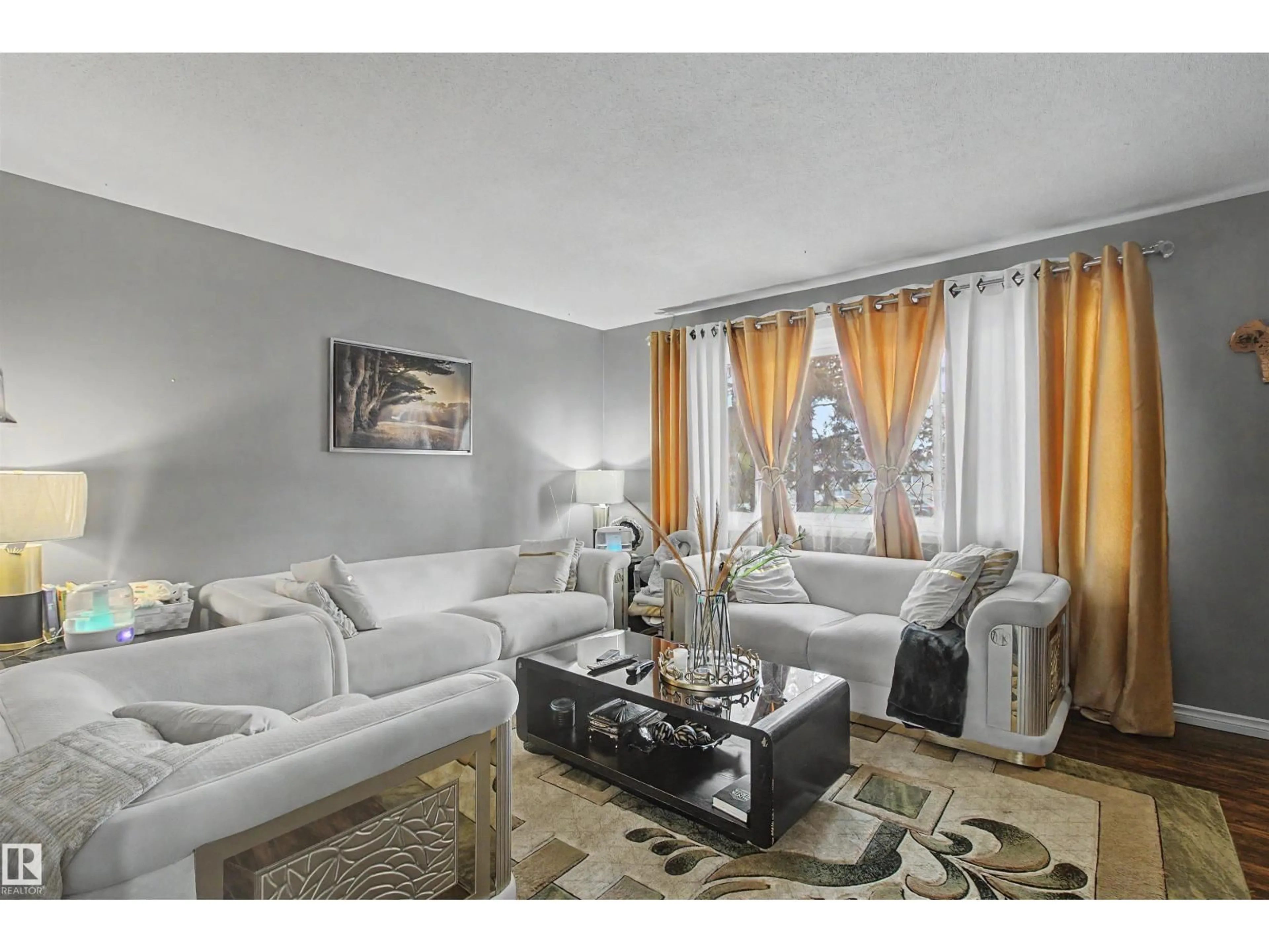 Living room with furniture, unknown for 5724 143 AV, Edmonton Alberta T5A1K1