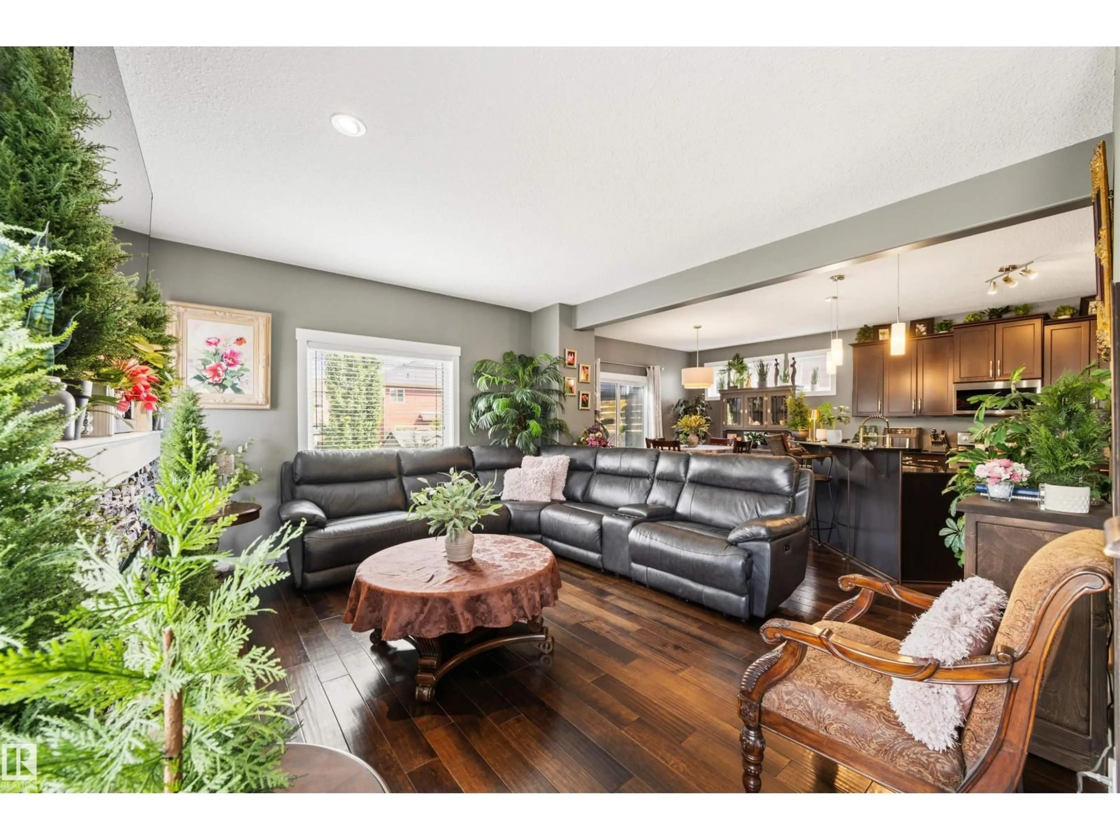 Living room with furniture, wood/laminate floor for SW - 1457 WATES LI, Edmonton Alberta T6W0V1