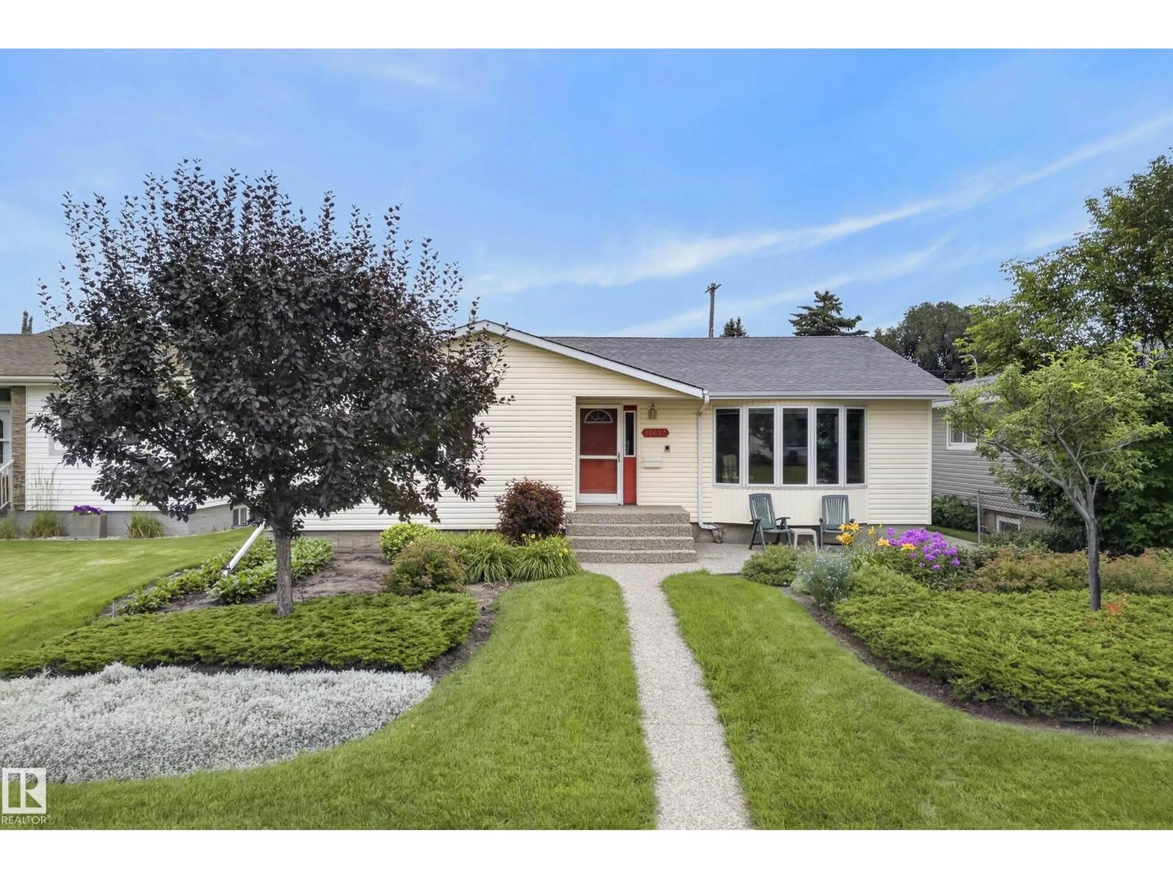 Home with vinyl exterior material, street for 10623 67 ST, Edmonton Alberta T6A2R9