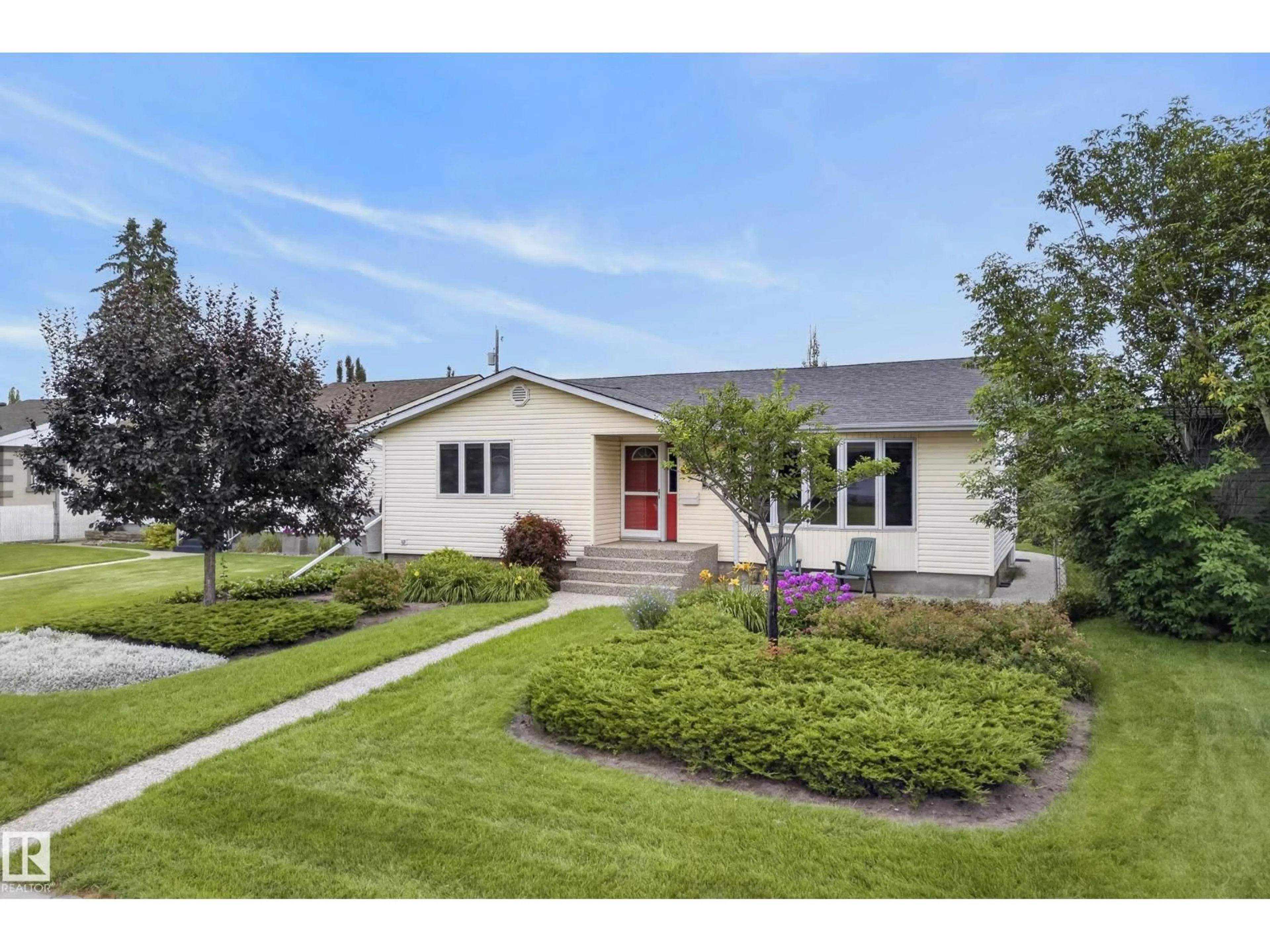 Home with vinyl exterior material, street for 10623 67 ST, Edmonton Alberta T6A2R9