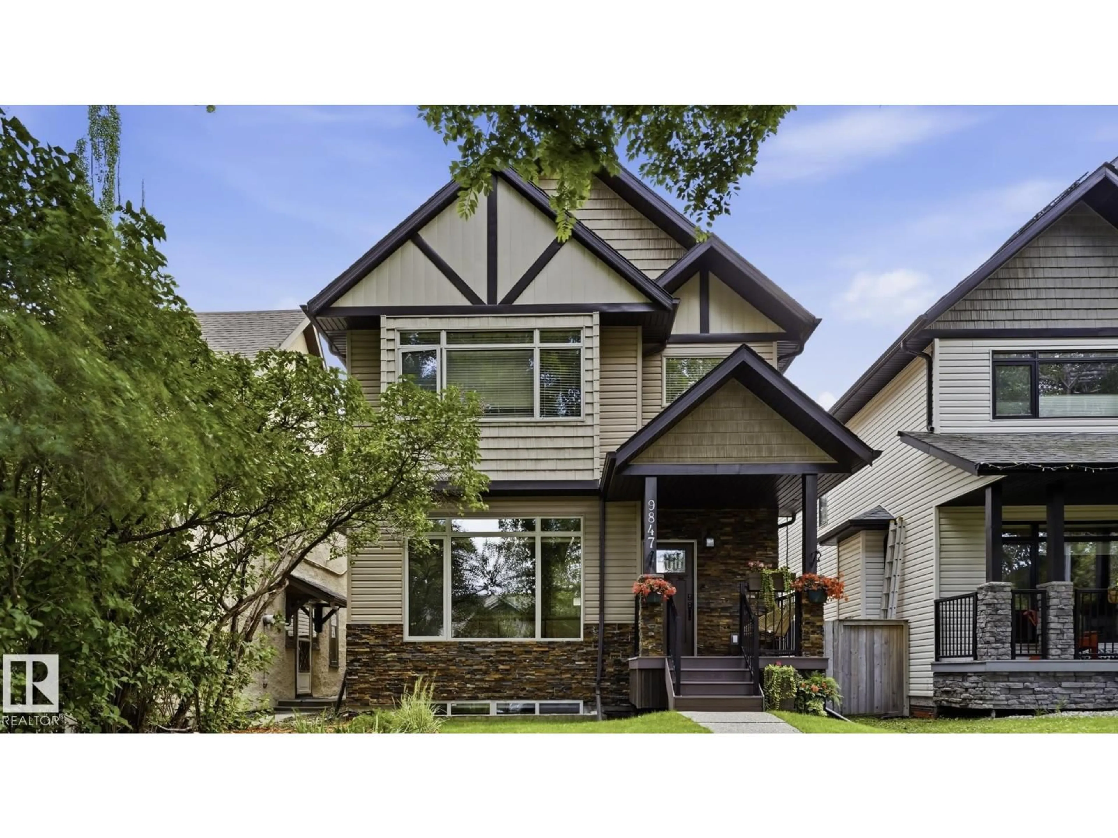 Home with brick exterior material, street for NW - 9847 92 AV, Edmonton Alberta T6E2V4