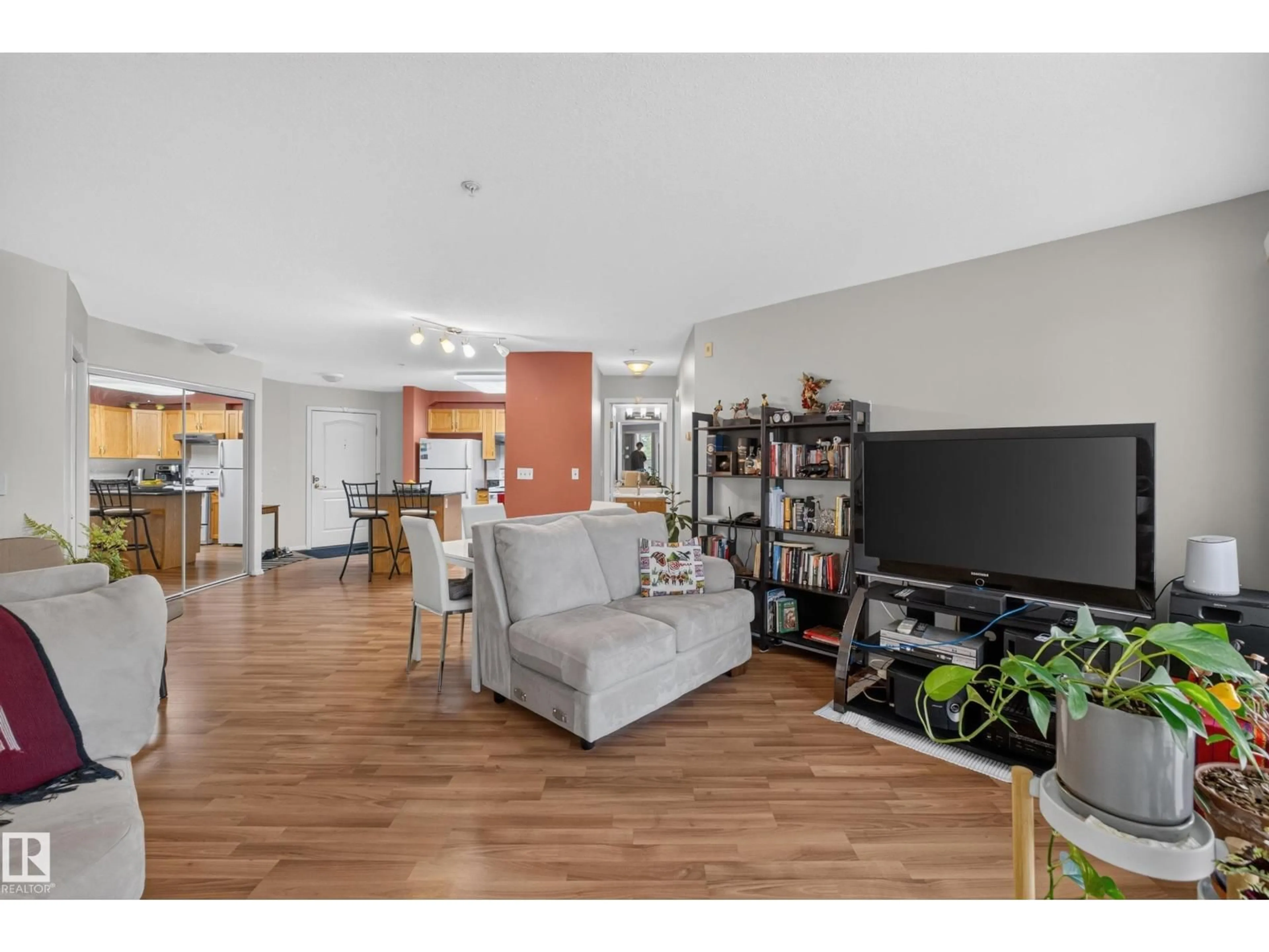 Living room with furniture, wood/laminate floor for #105 - 10421 42 AV, Edmonton Alberta T6A7C8