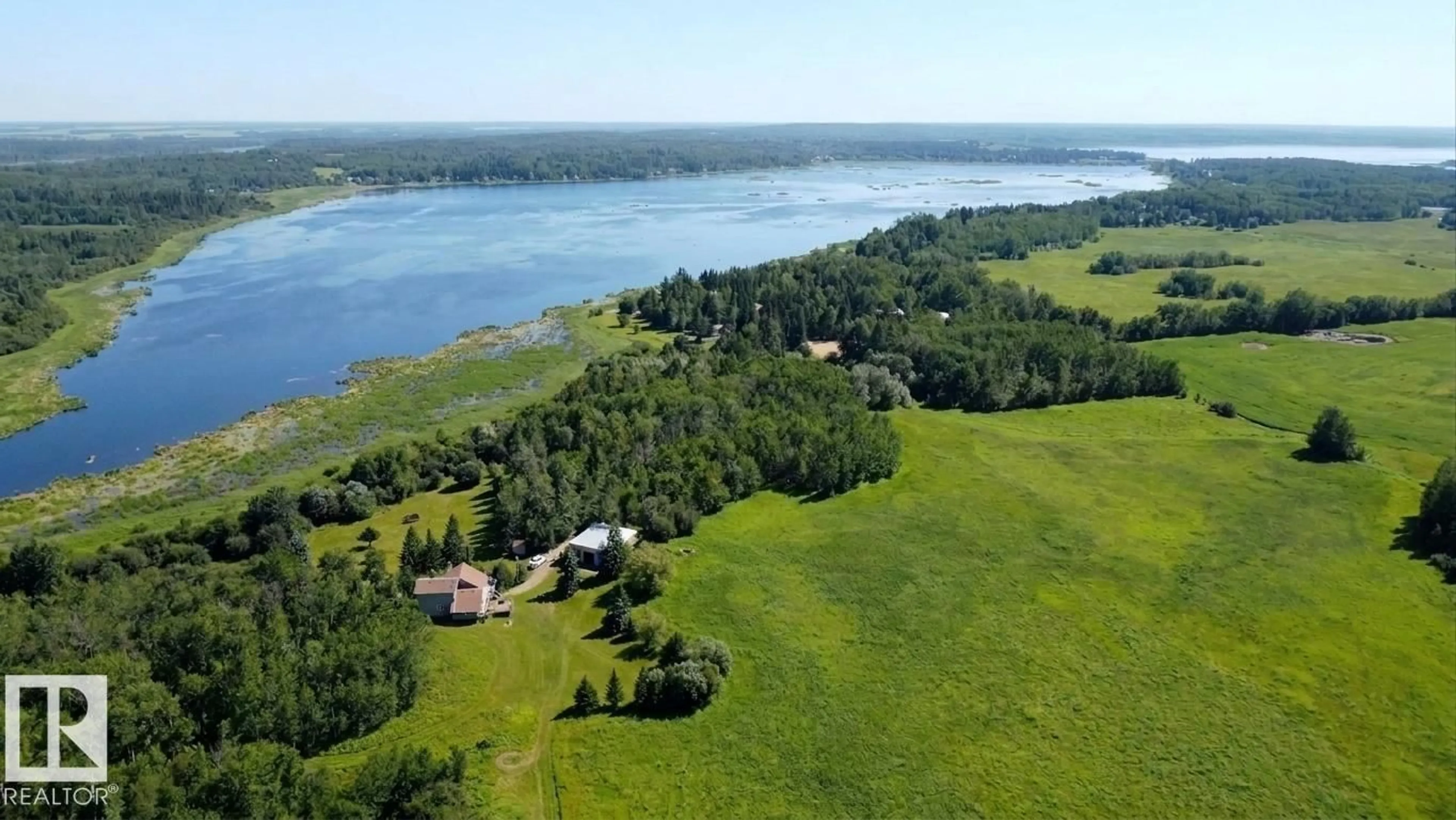 A pic from outside/outdoor area/front of a property/back of a property/a pic from drone, water/lake/river/ocean view for 56019 RGE ROAD 13, Rural Lac Ste. Anne County Alberta T0E1V0