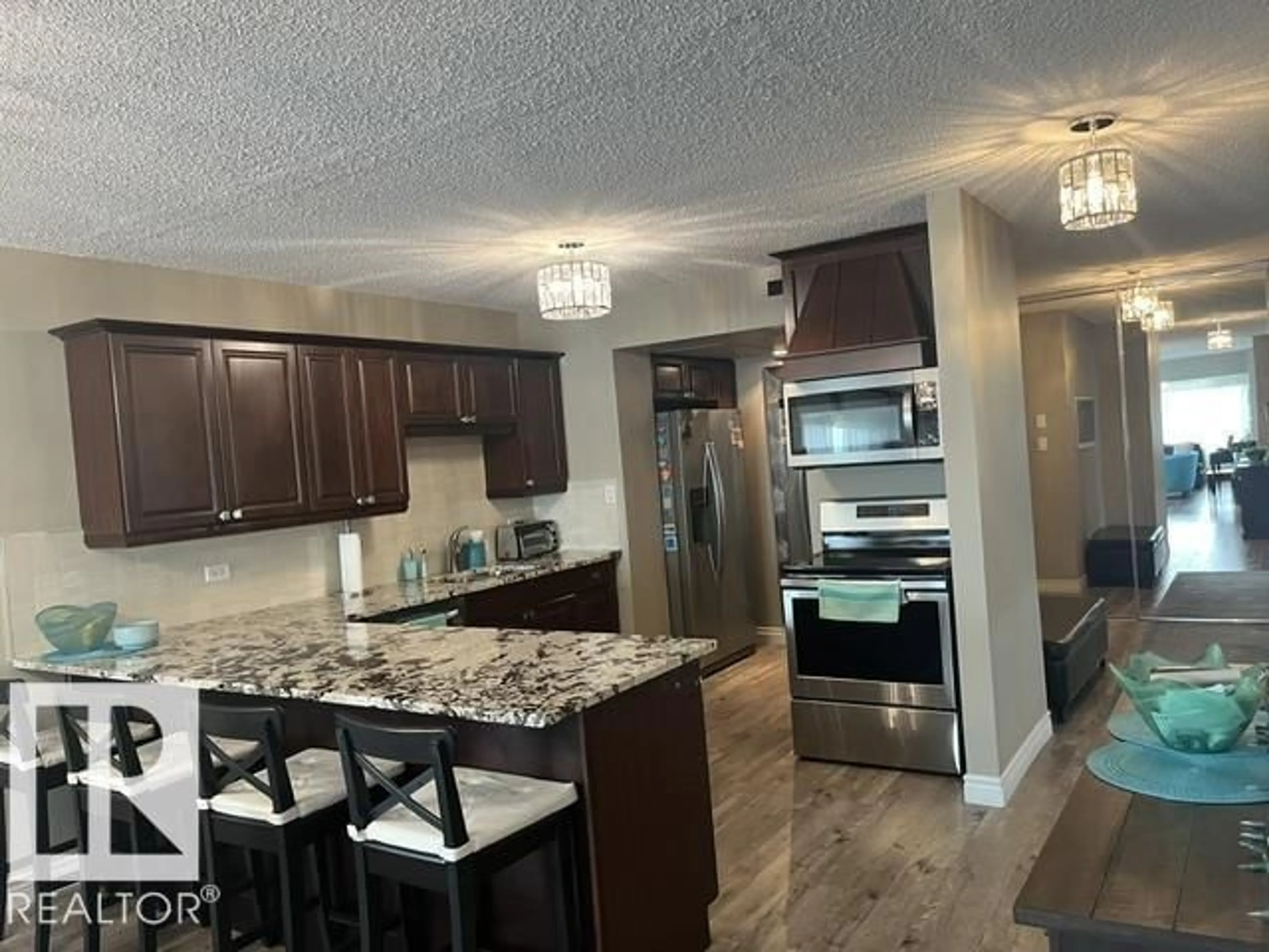 Open concept kitchen, wood/laminate floor for 10011 - 1501 123 ST, Edmonton Alberta T5N1M9