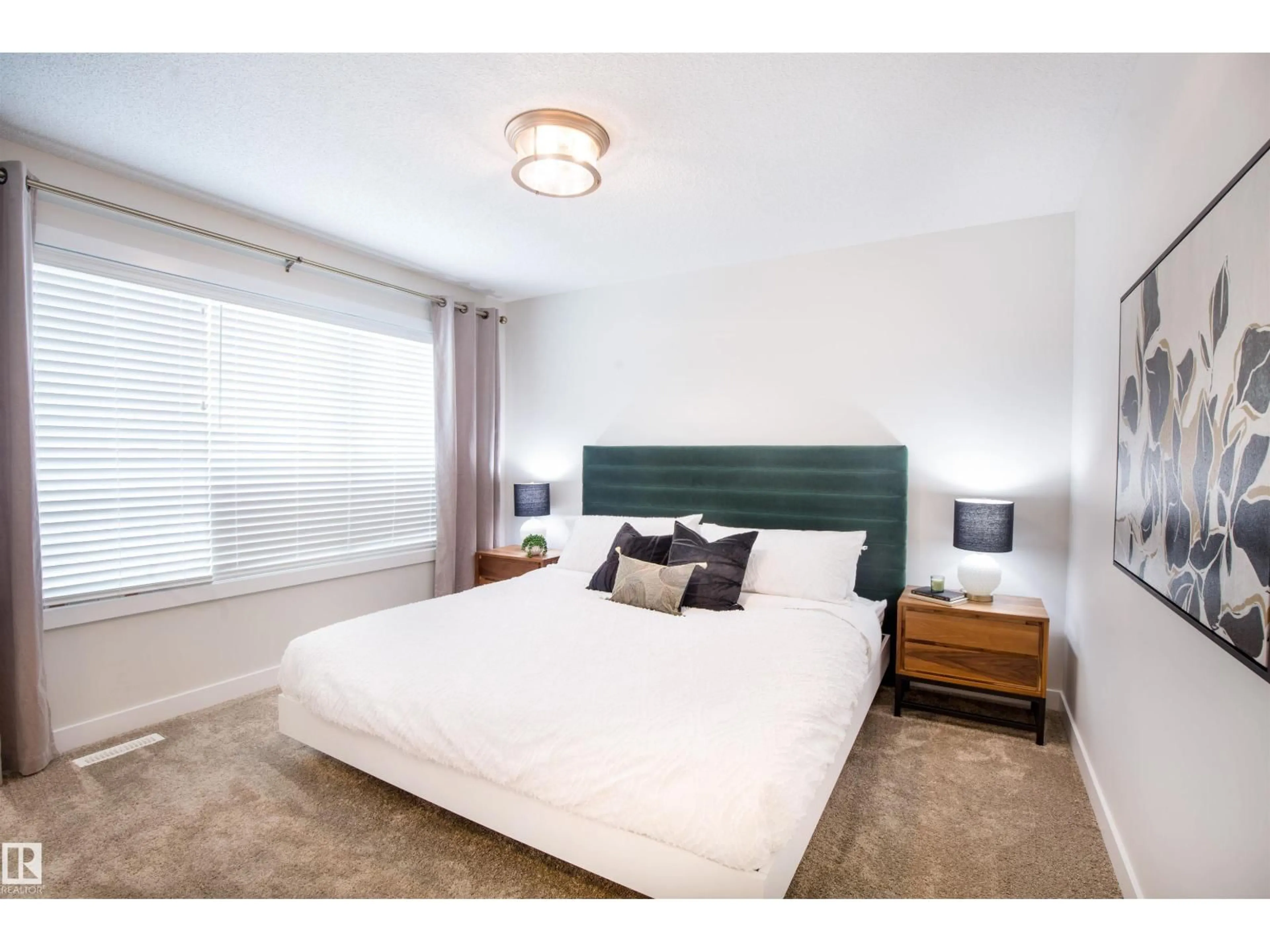 Bedroom with bed, unknown for 2152 1 AV SW, Edmonton Alberta T6X3E2