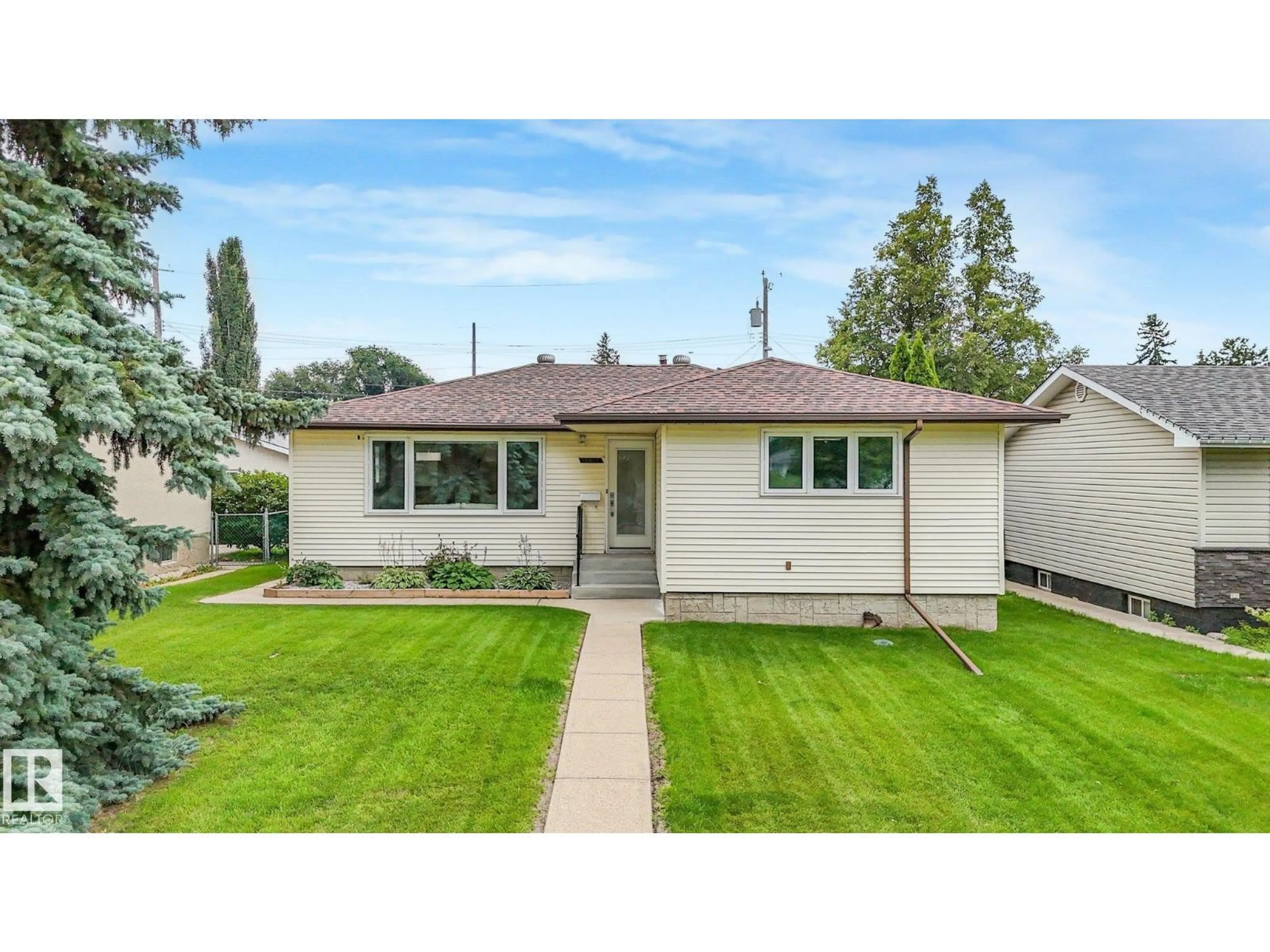 Home with vinyl exterior material, street for 15617 80 AV, Edmonton Alberta T5R3M4