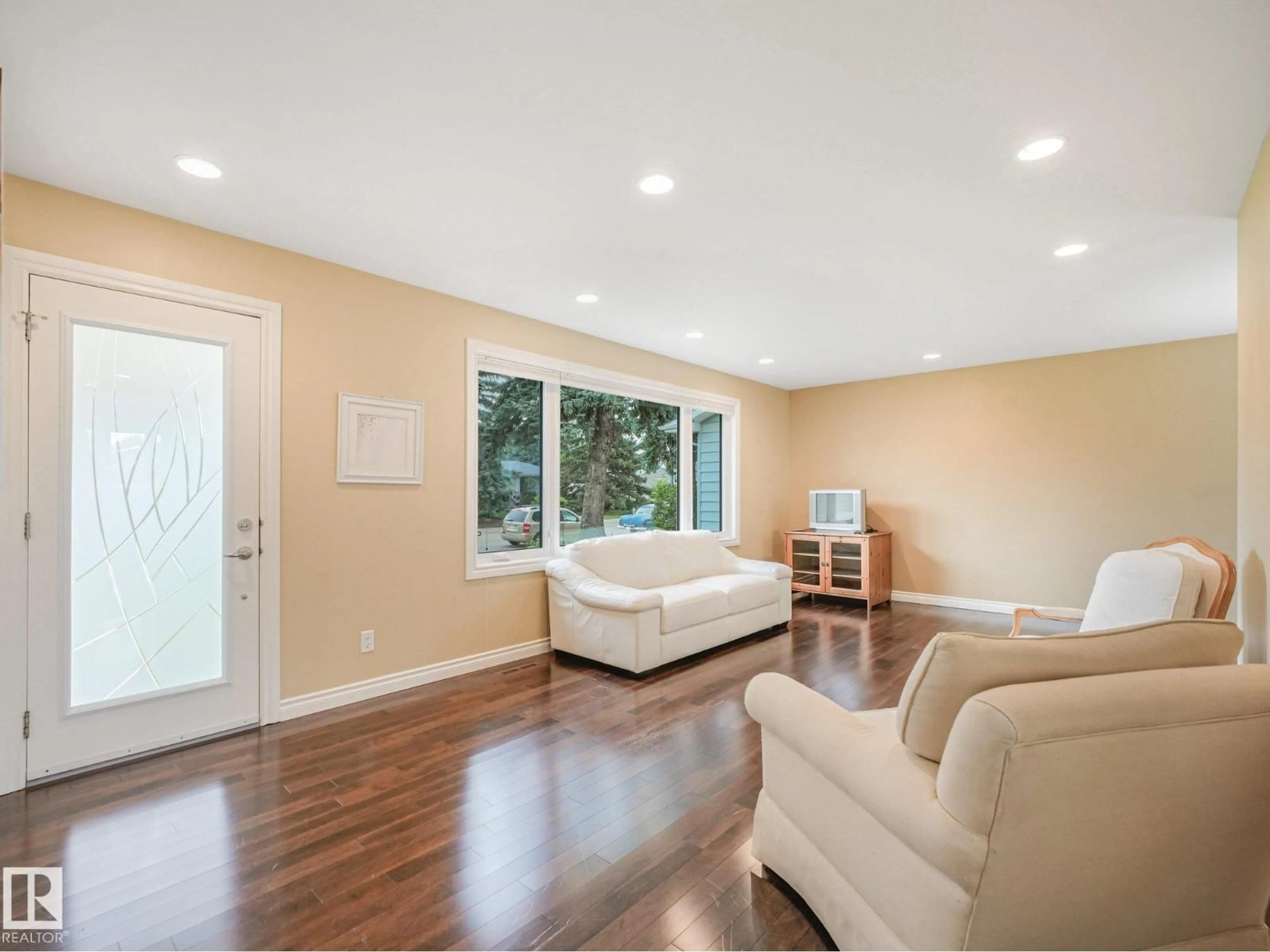 Living room with furniture, wood/laminate floor for 15617 80 AV, Edmonton Alberta T5R3M4