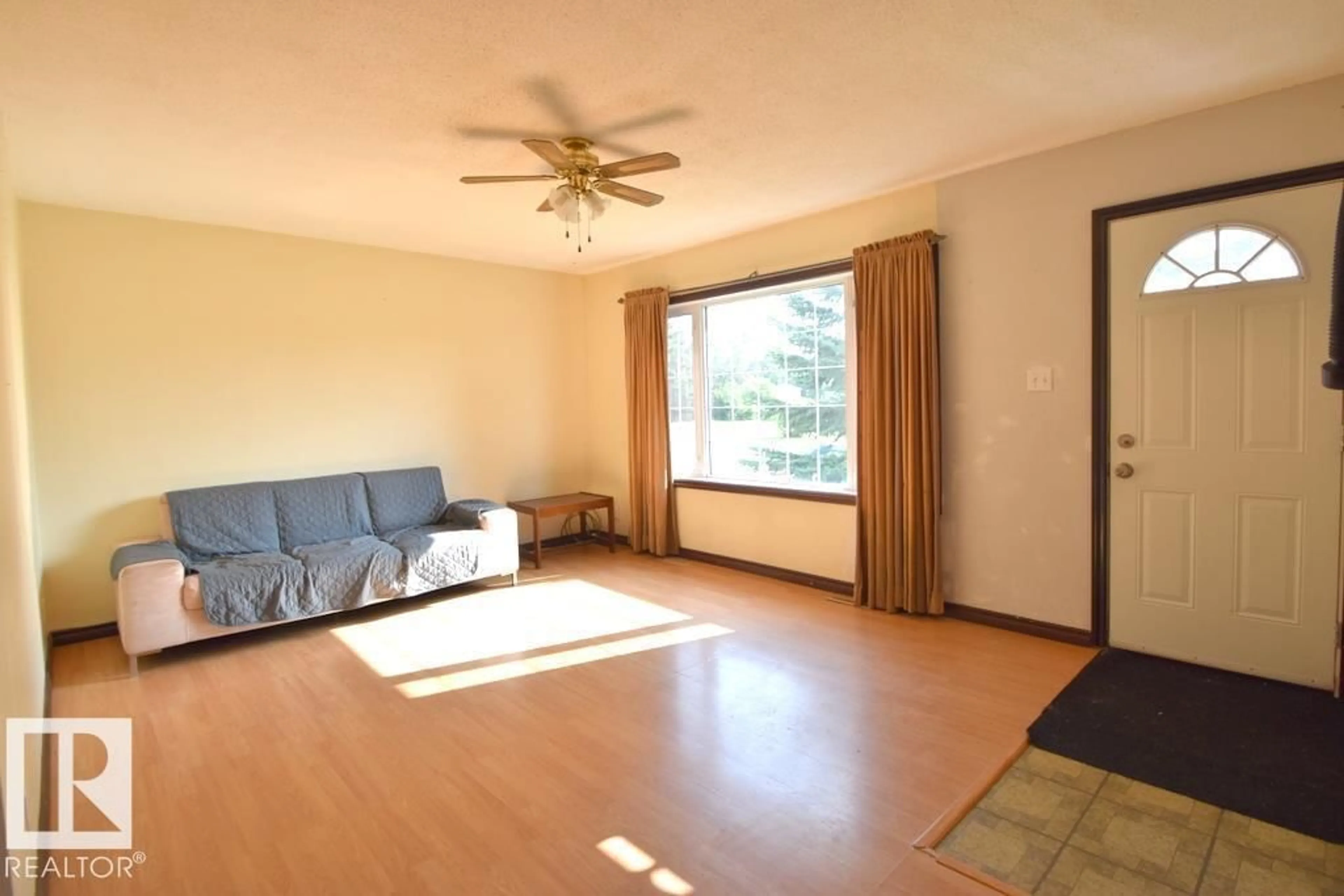 Living room with furniture, wood/laminate floor for 5007 2 ST, Boyle Alberta T0A0M0