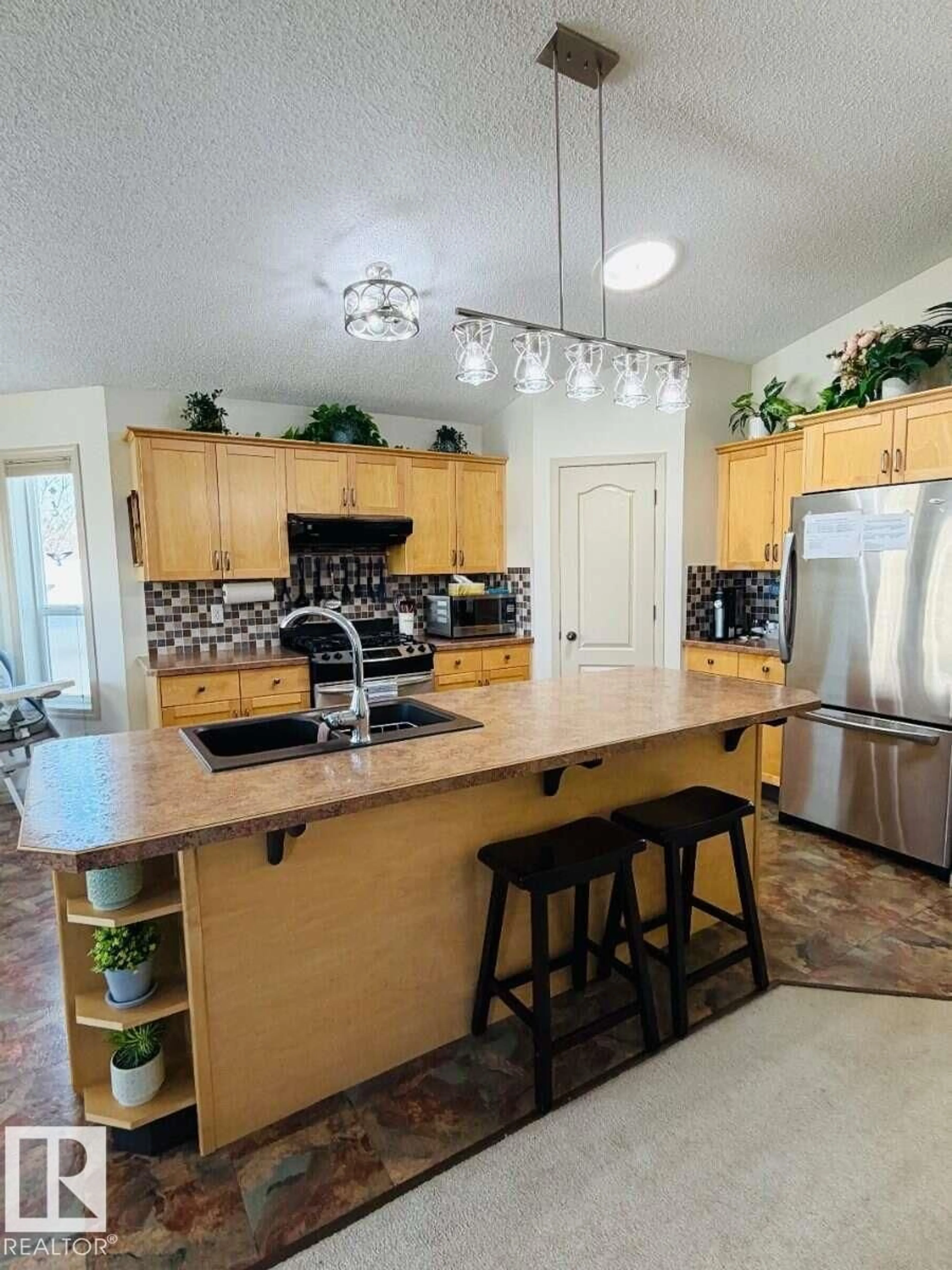 Open concept kitchen, ceramic/tile floor for 5004 53 ST, Bon Accord Alberta T0A0K0