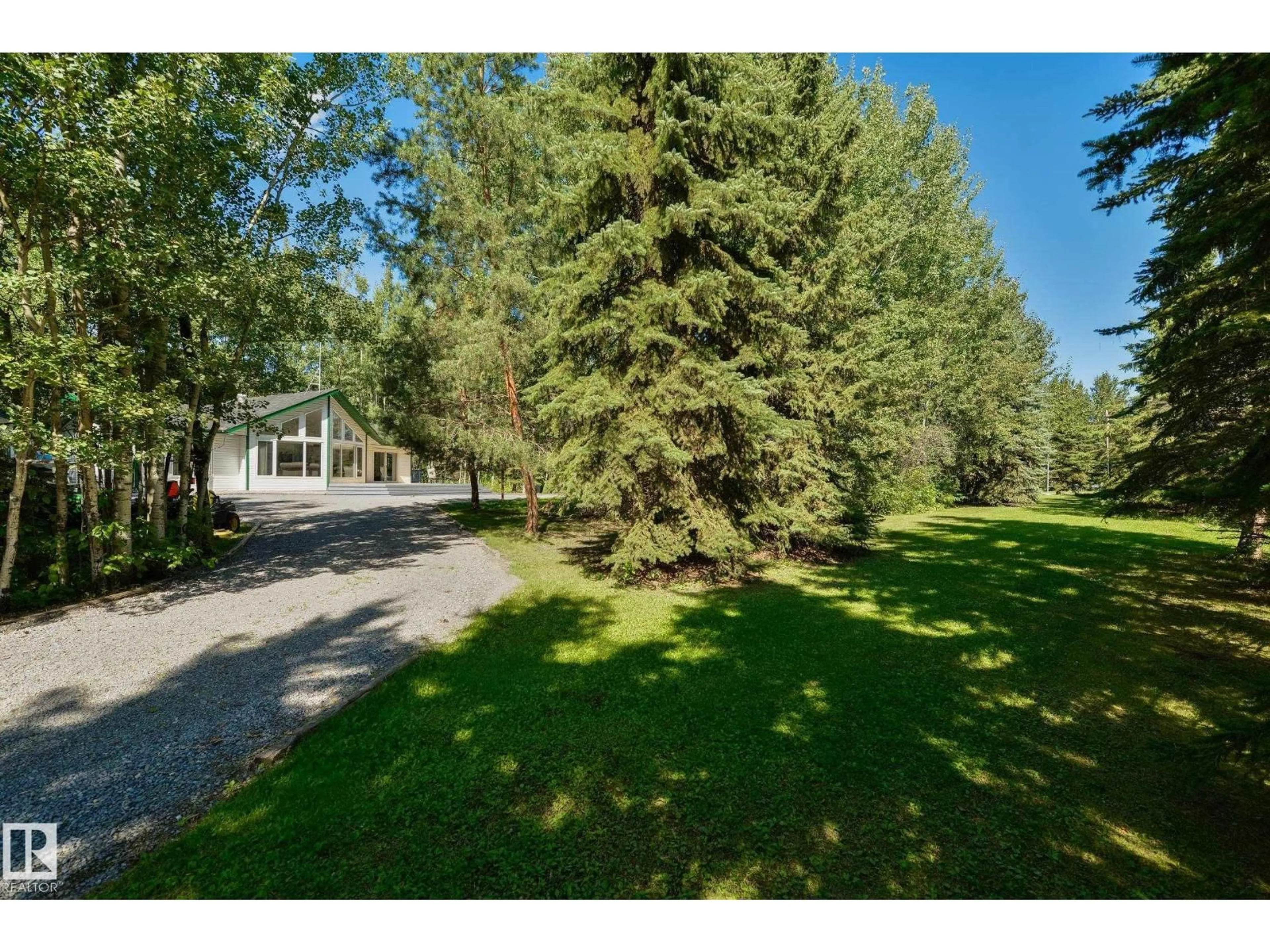 A pic from outside/outdoor area/front of a property/back of a property/a pic from drone, forest/trees view for 31 - 20 53123 HWY, Rural Parkland County Alberta T0E2B0