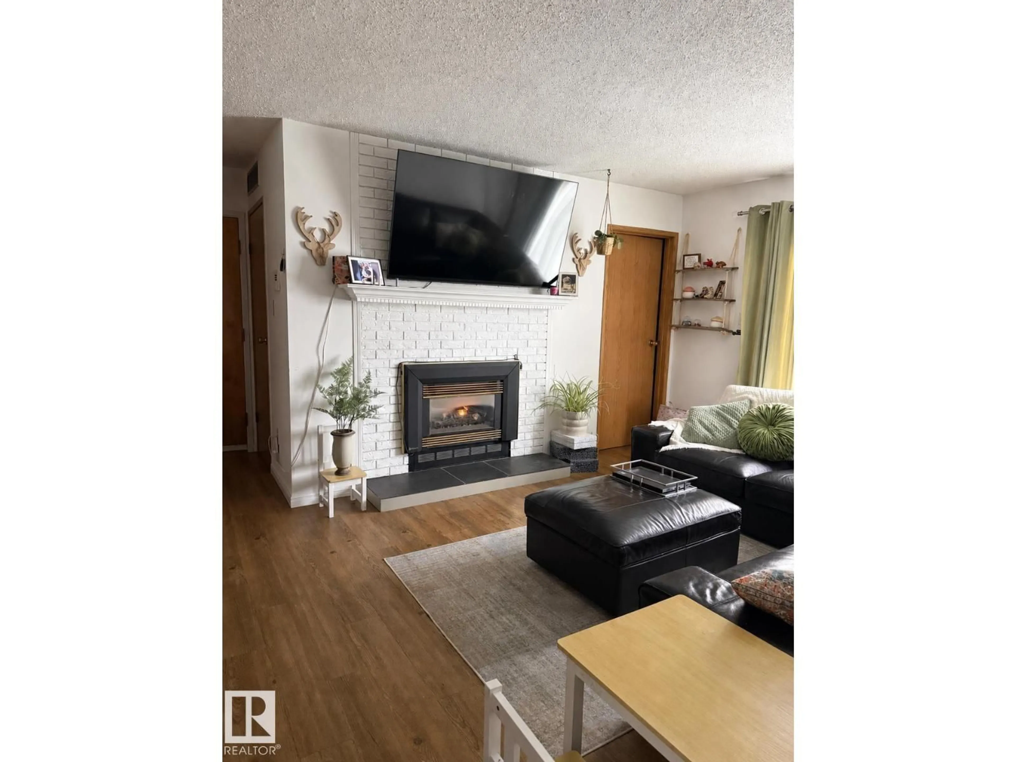 Living room with furniture, wood/laminate floor for 302 - 44 ALPINE PL, St. Albert Alberta T8N3Y2