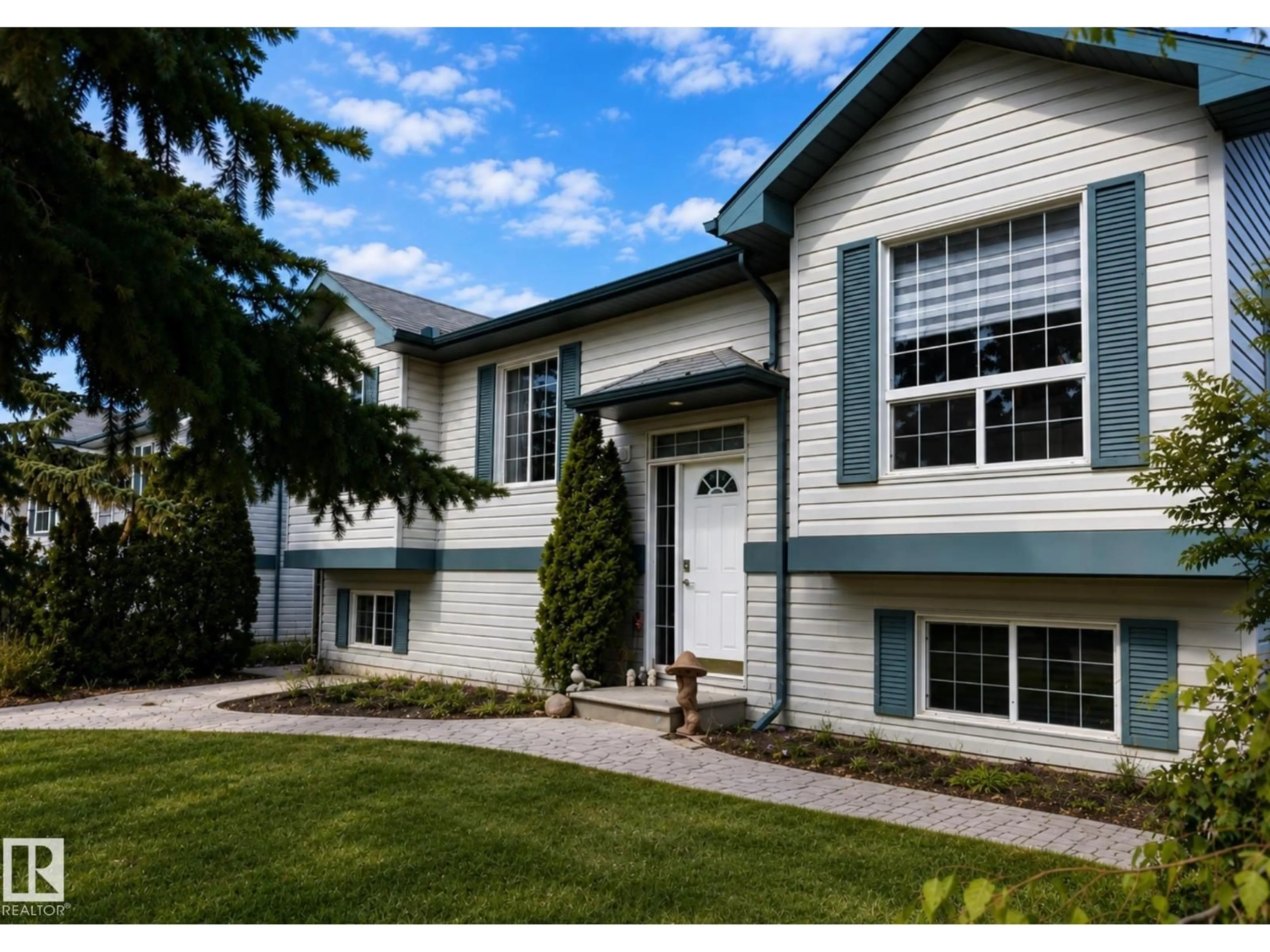Home with vinyl exterior material, street for 4 SPRUCE MEADOW LN, Bon Accord Alberta T0A0K0