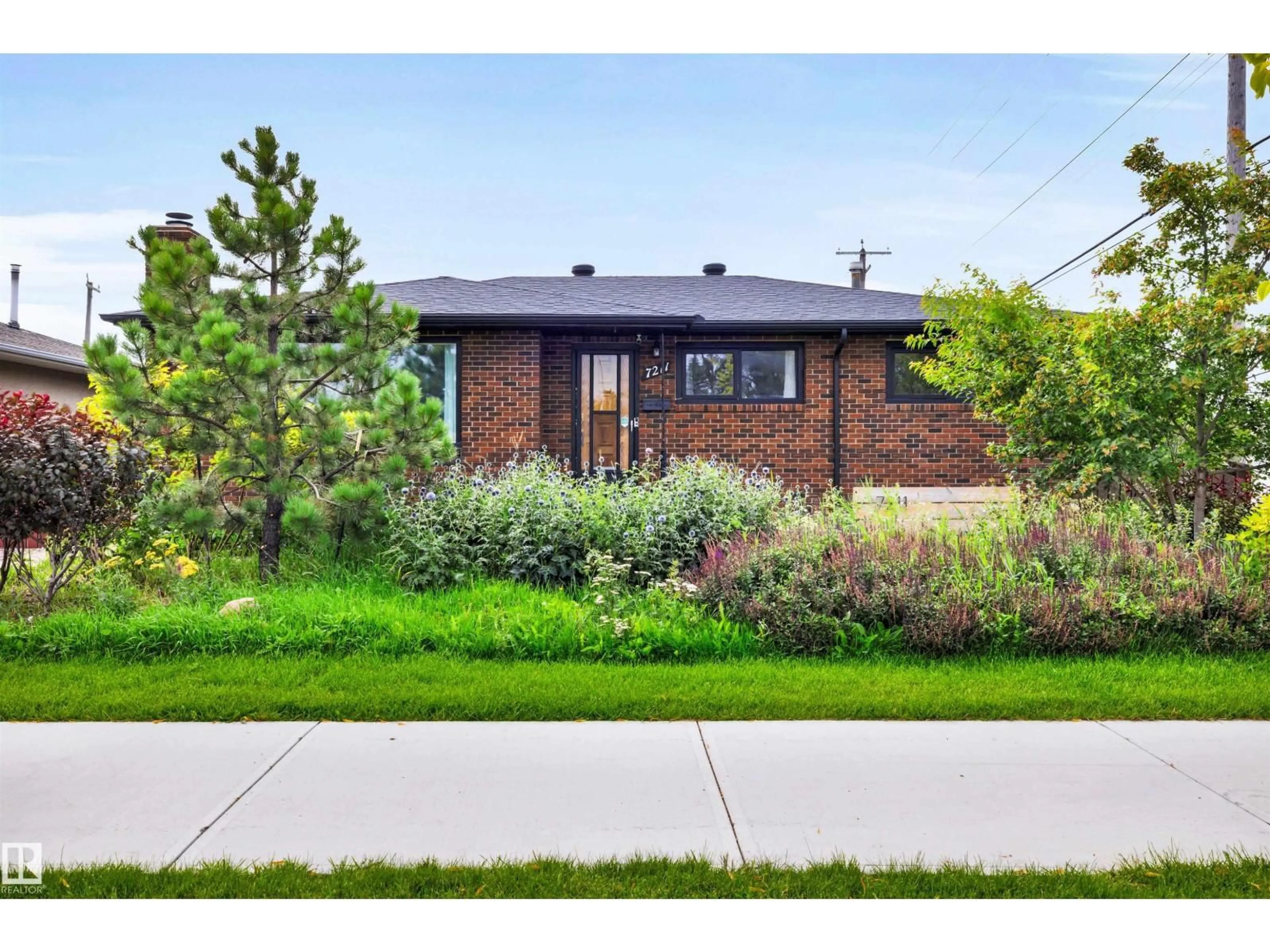 Home with brick exterior material, street for NW - 7211 132 AV, Edmonton Alberta T5C3C6