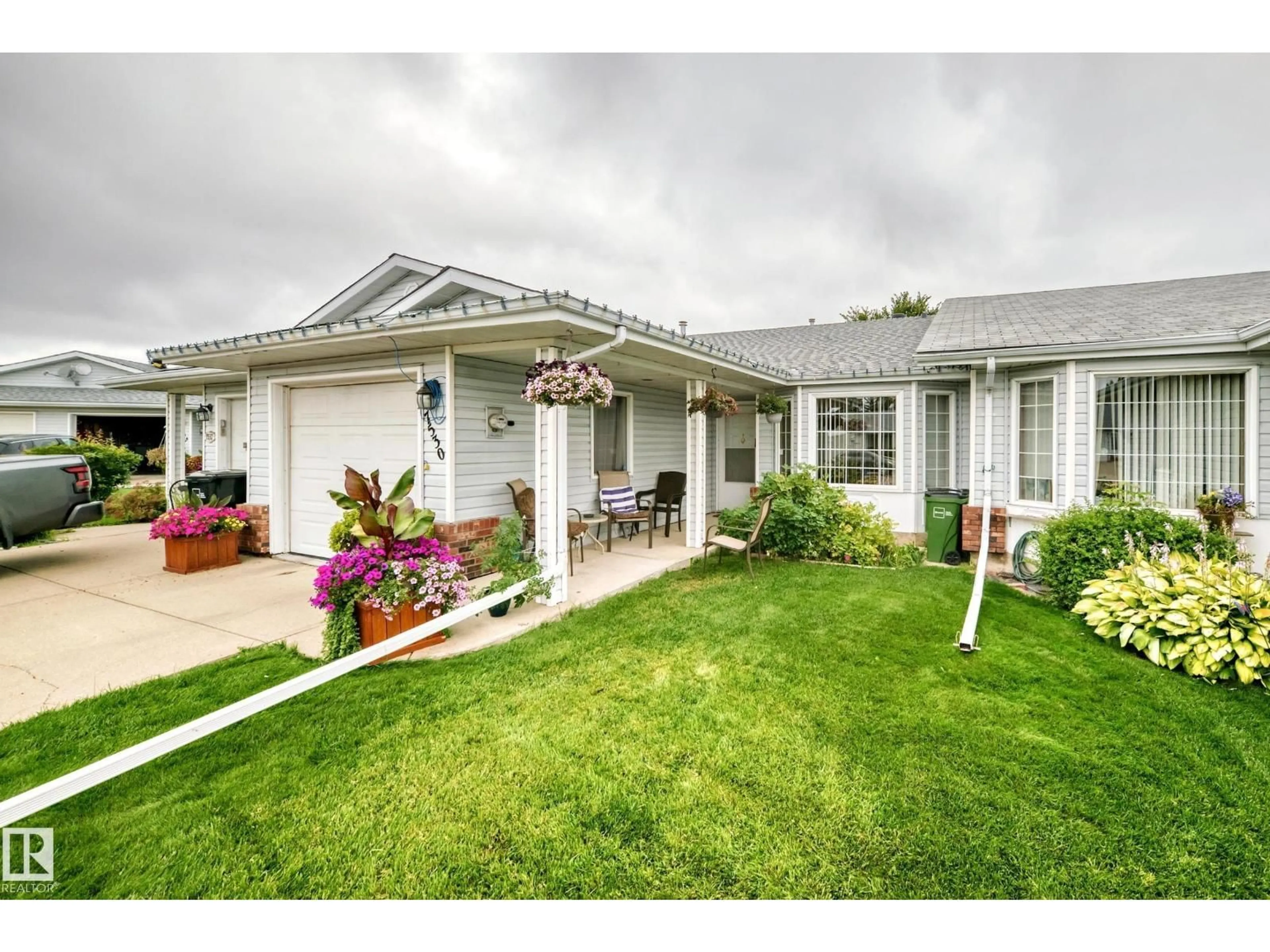 Home with vinyl exterior material, street for 7530 137A AV, Edmonton Alberta T5C3R4