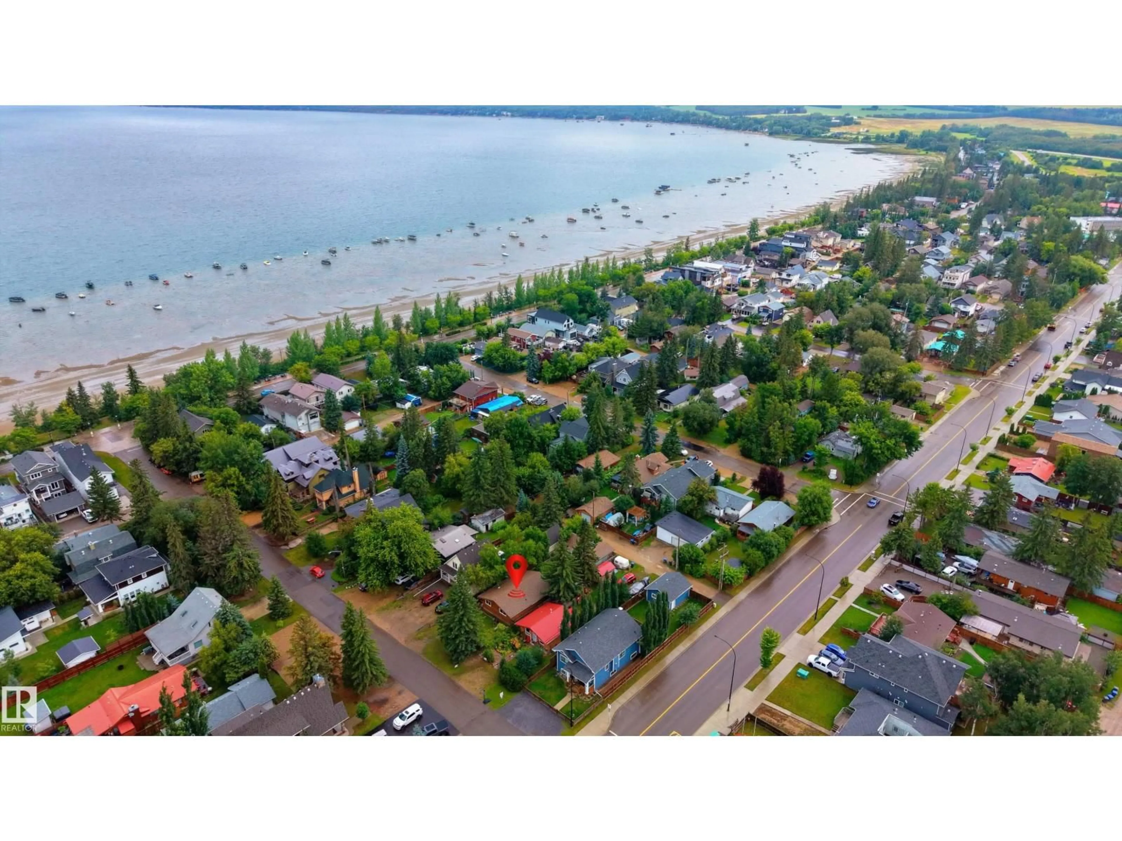 A pic from outside/outdoor area/front of a property/back of a property/a pic from drone, water/lake/river/ocean view for 5011 38 STREET, Sylvan Lake Alberta T4S1B6