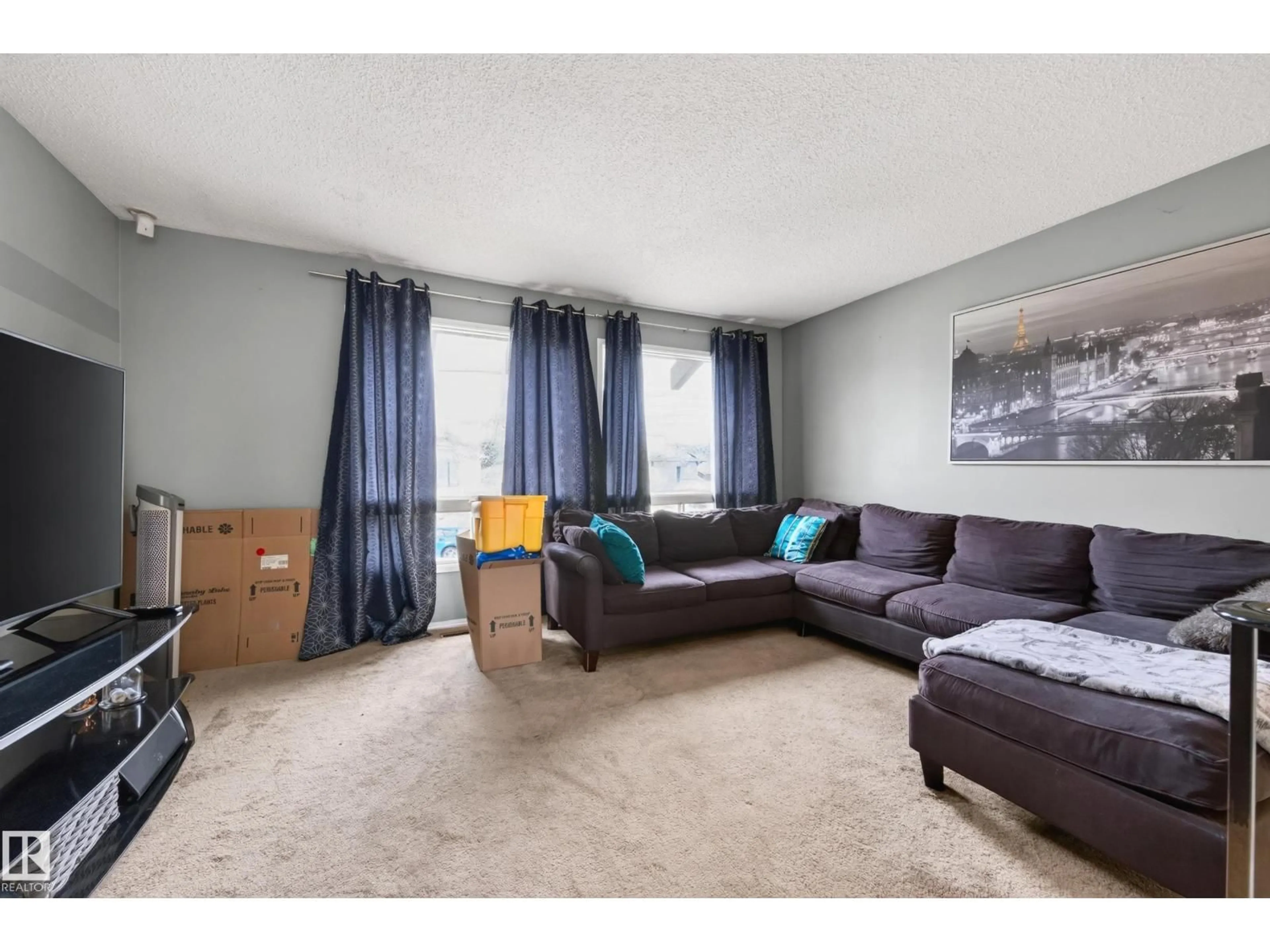 Living room with furniture, unknown for NW - 14531 31A ST, Edmonton Alberta T5Y2A9