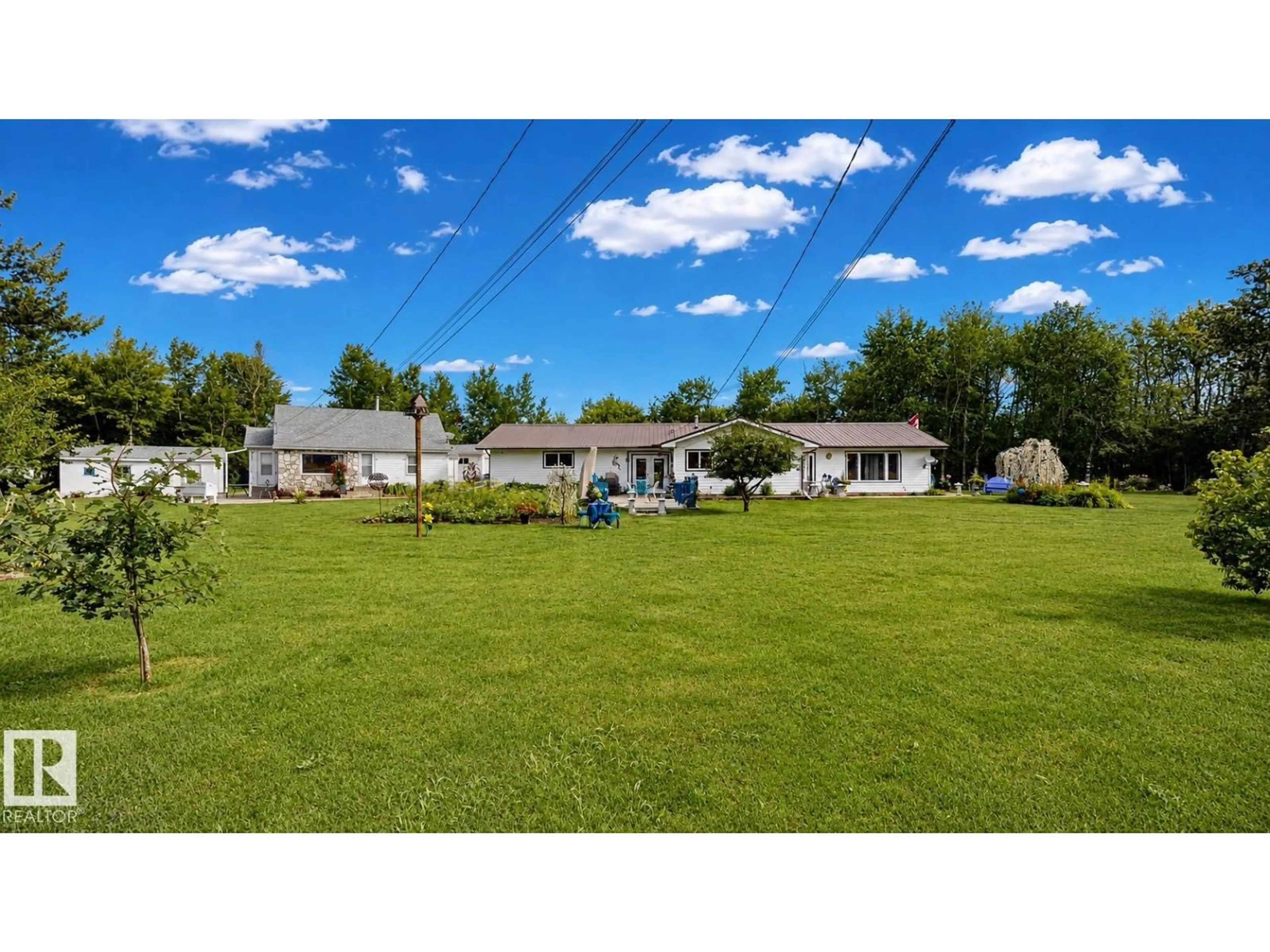 A pic from outside/outdoor area/front of a property/back of a property/a pic from drone, mountain view for 10032 108 ST, Westlock Alberta T7P1M9