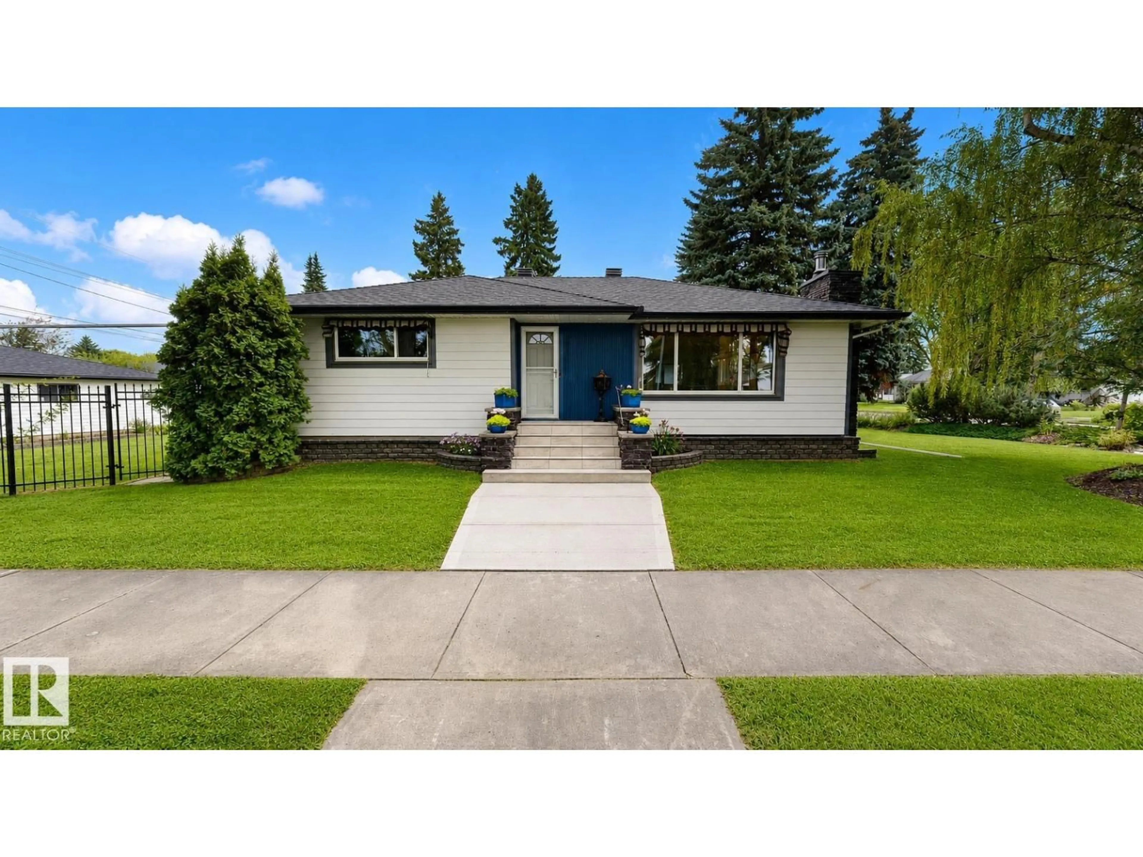 Home with vinyl exterior material, street for 9503 77 ST, Edmonton Alberta T6C2M8