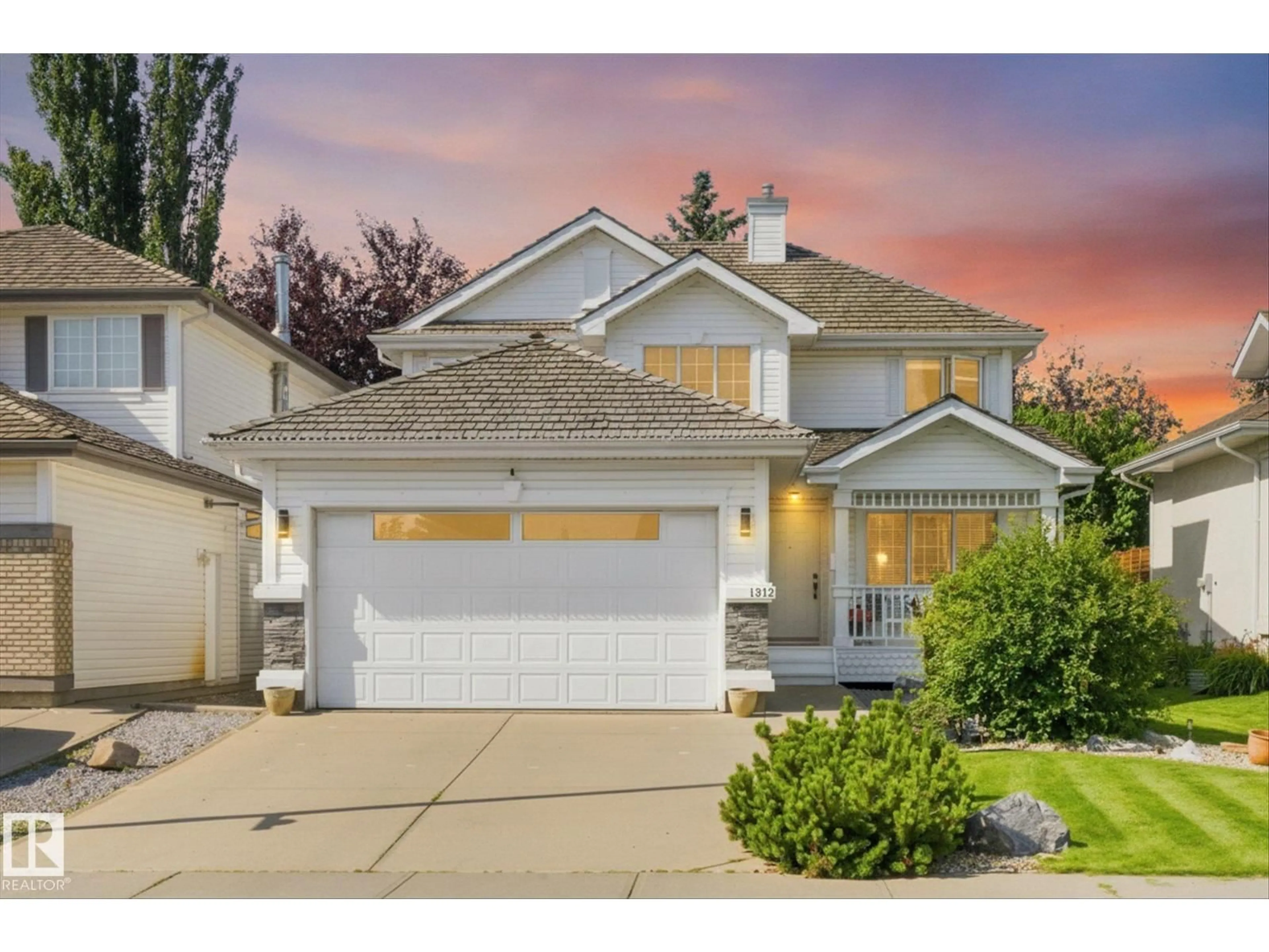 Home with vinyl exterior material, street for 1312 116 ST, Edmonton Alberta T6J7B3