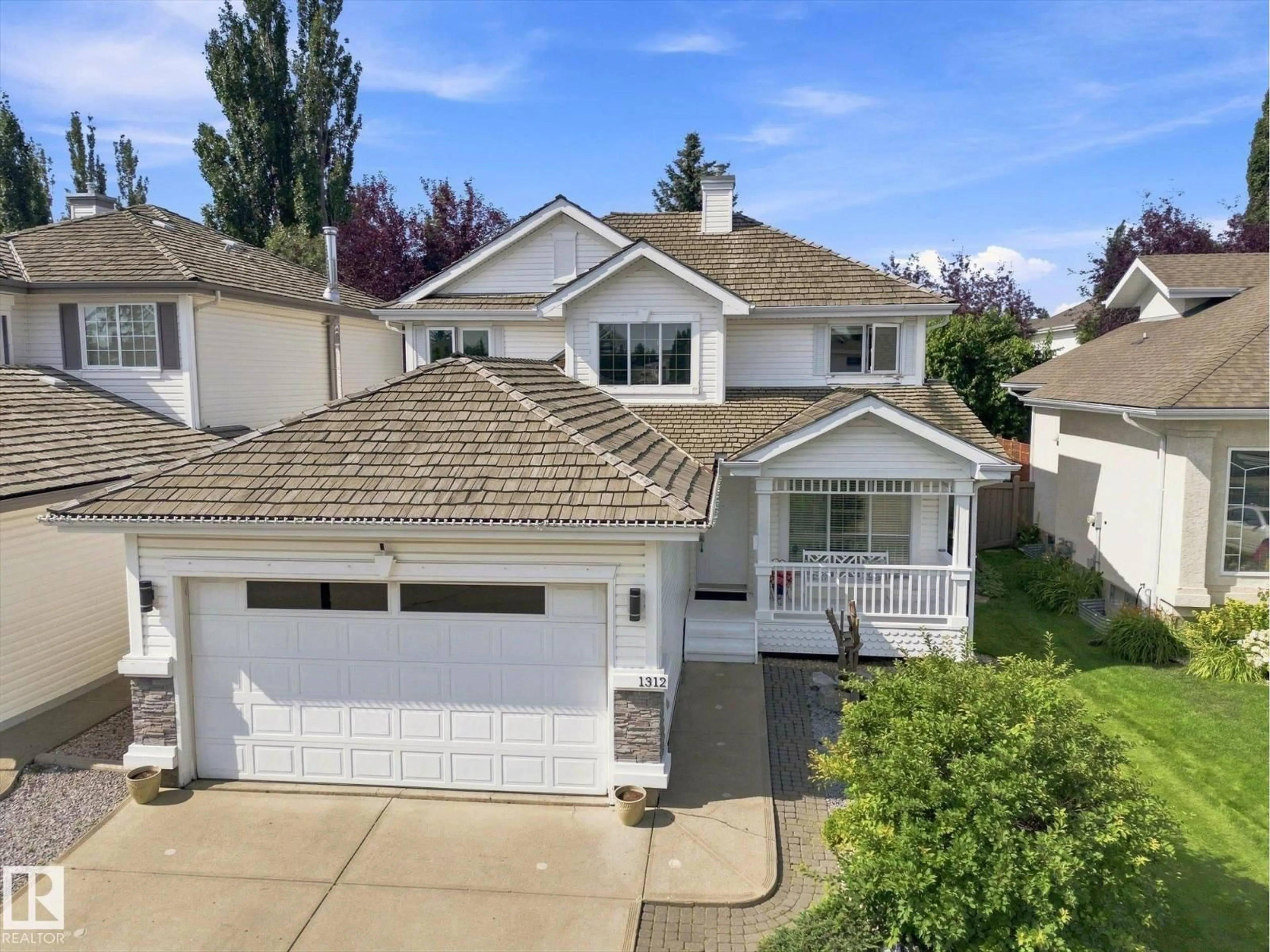 A pic from outside/outdoor area/front of a property/back of a property/a pic from drone, street for 1312 116 ST, Edmonton Alberta T6J7B3