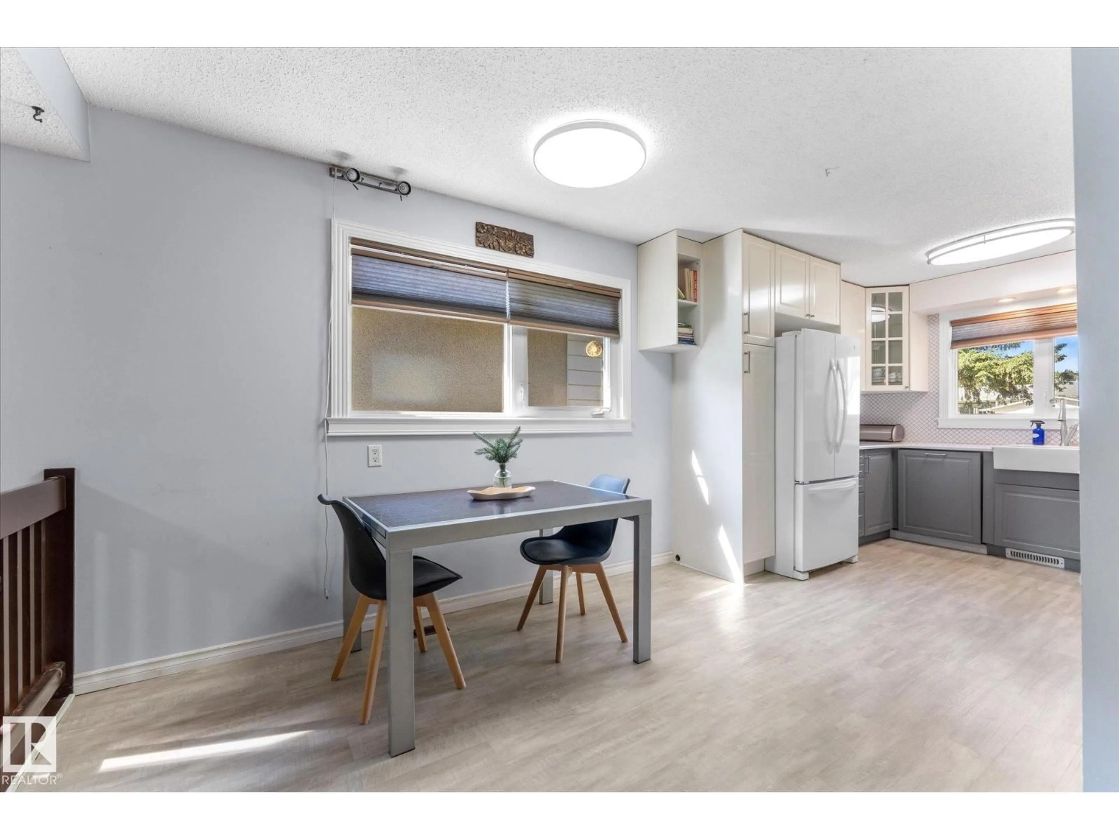 Open concept kitchen, wood/laminate floor for 1036 82 ST, Edmonton Alberta T6K1X6