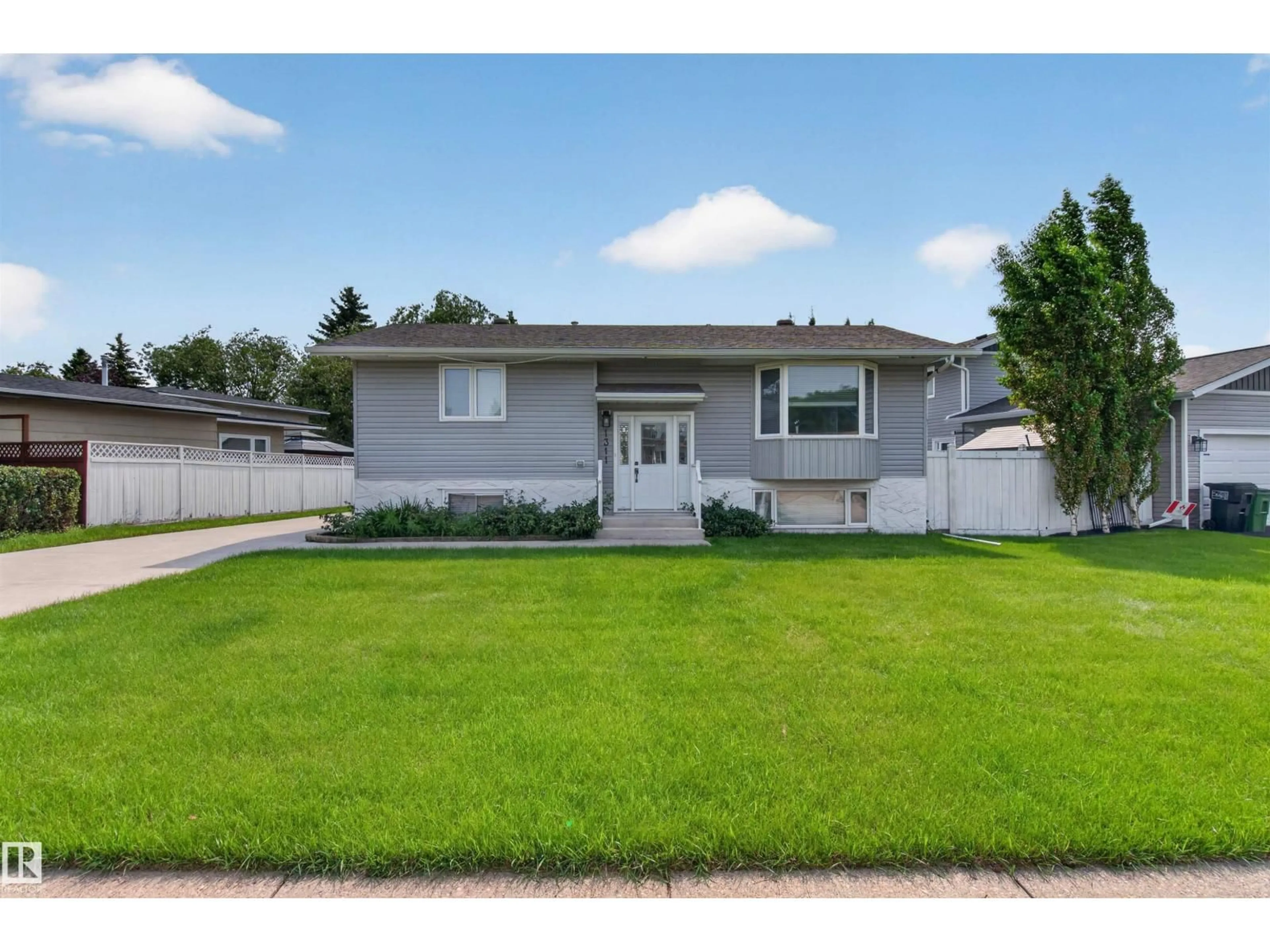Home with vinyl exterior material, street for 1311 85 ST, Edmonton Alberta T6K1X7
