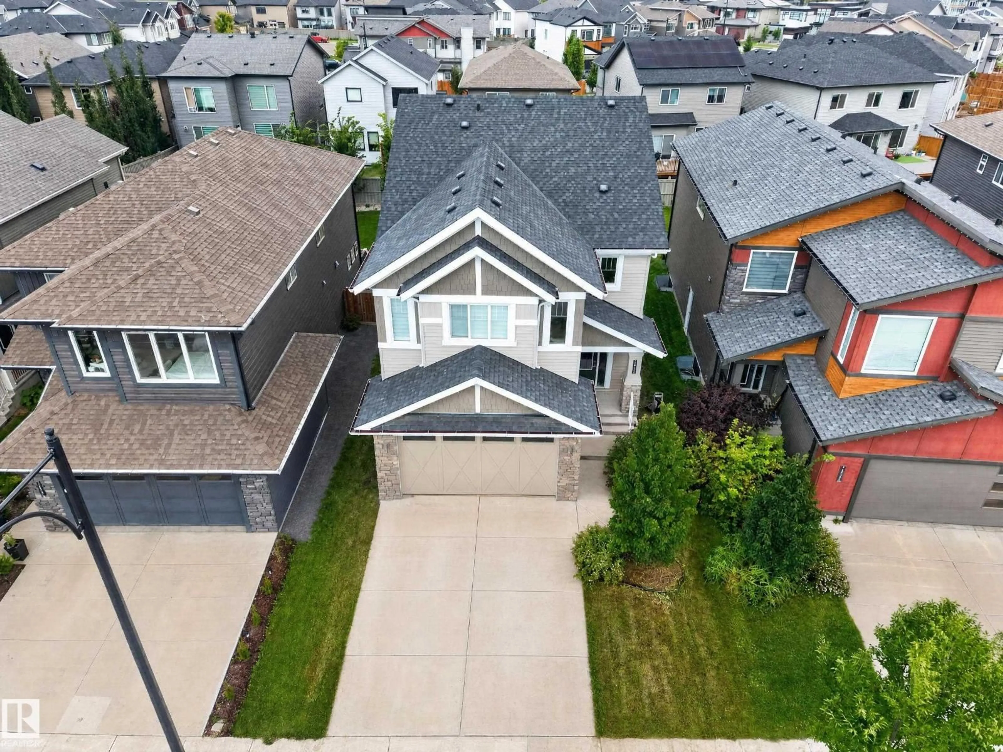 A pic from outside/outdoor area/front of a property/back of a property/a pic from drone, street for SW SW - 7014 CHIVERS LO, Edmonton Alberta T6W3Y7