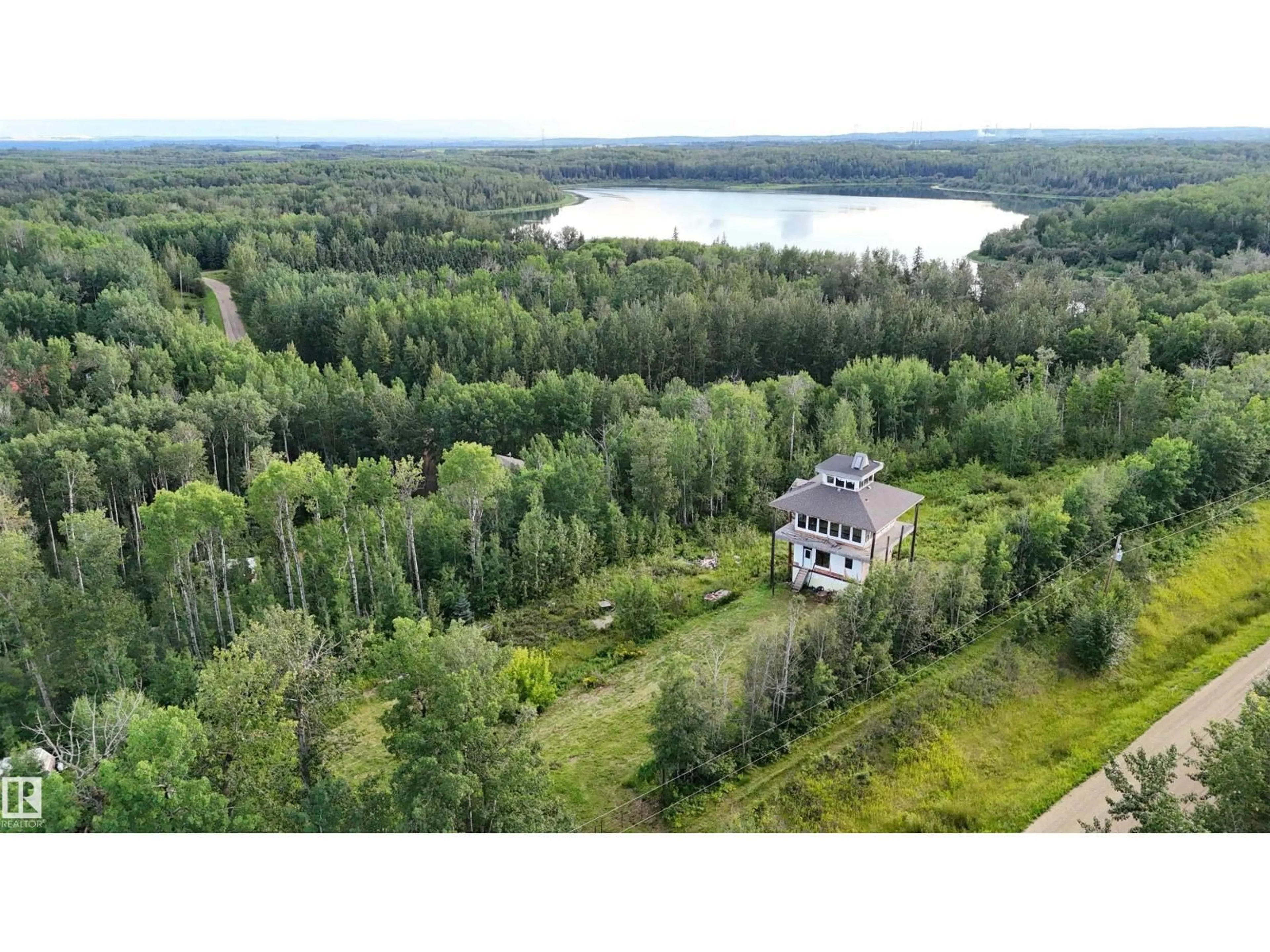 A pic from outside/outdoor area/front of a property/back of a property/a pic from drone, forest/trees view for 60 52228 RGE ROAD 30, Rural Parkland County Alberta T7Y2M5