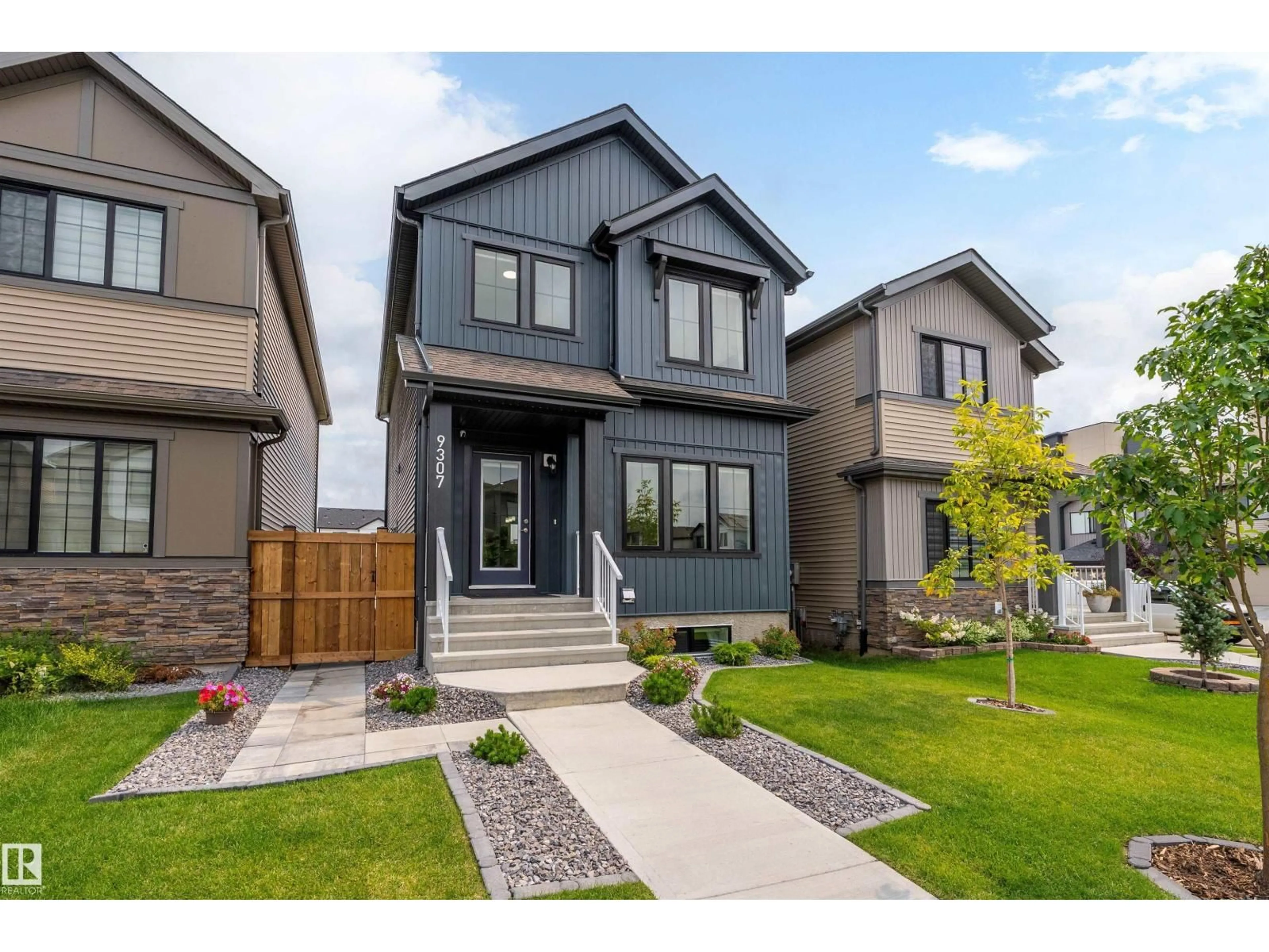 Home with vinyl exterior material, street for NW - 9307 221 ST, Edmonton Alberta T5T6C9