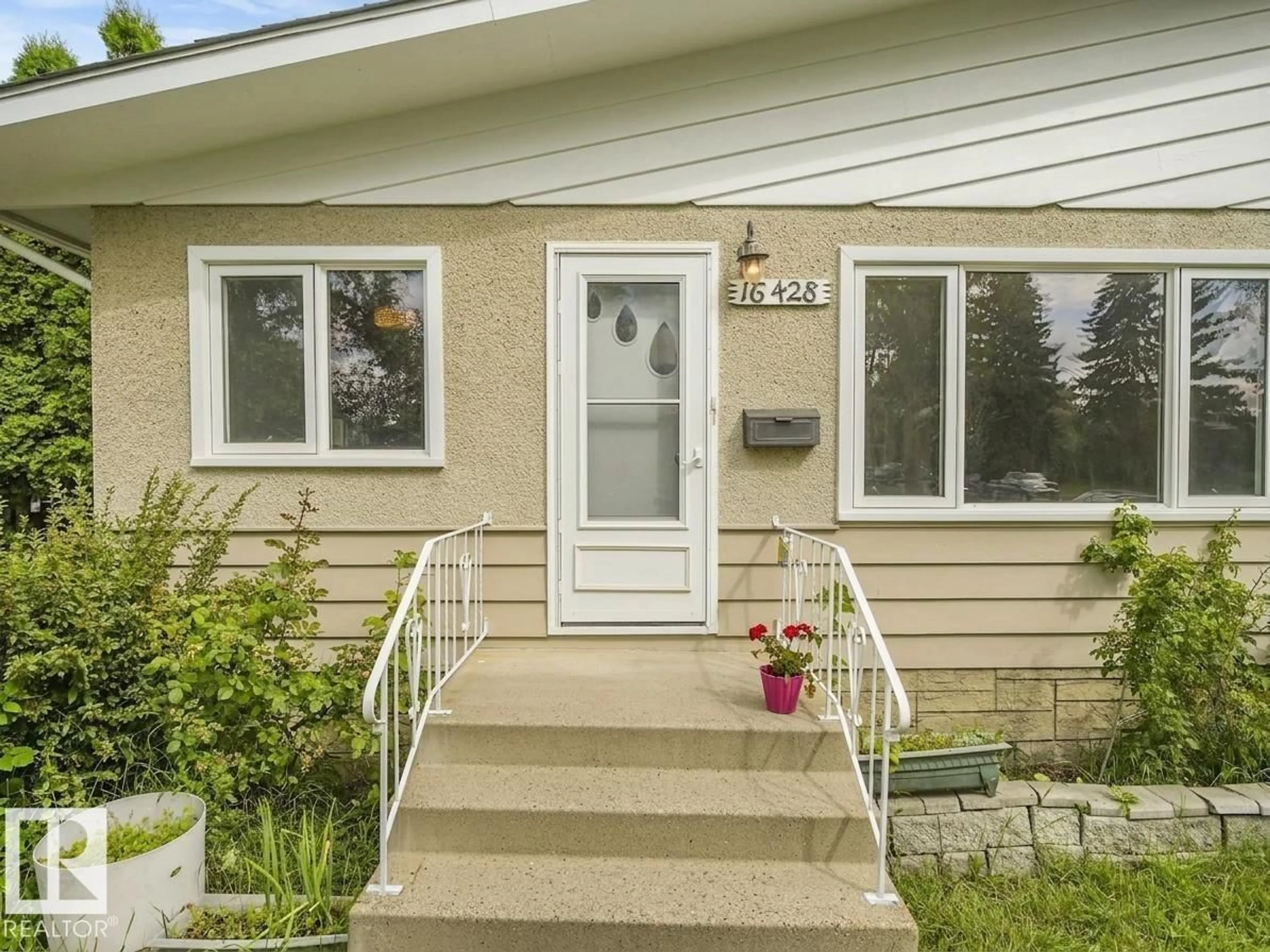 Home with vinyl exterior material, street for NW - 16428 88 AV, Edmonton Alberta T5R4M7