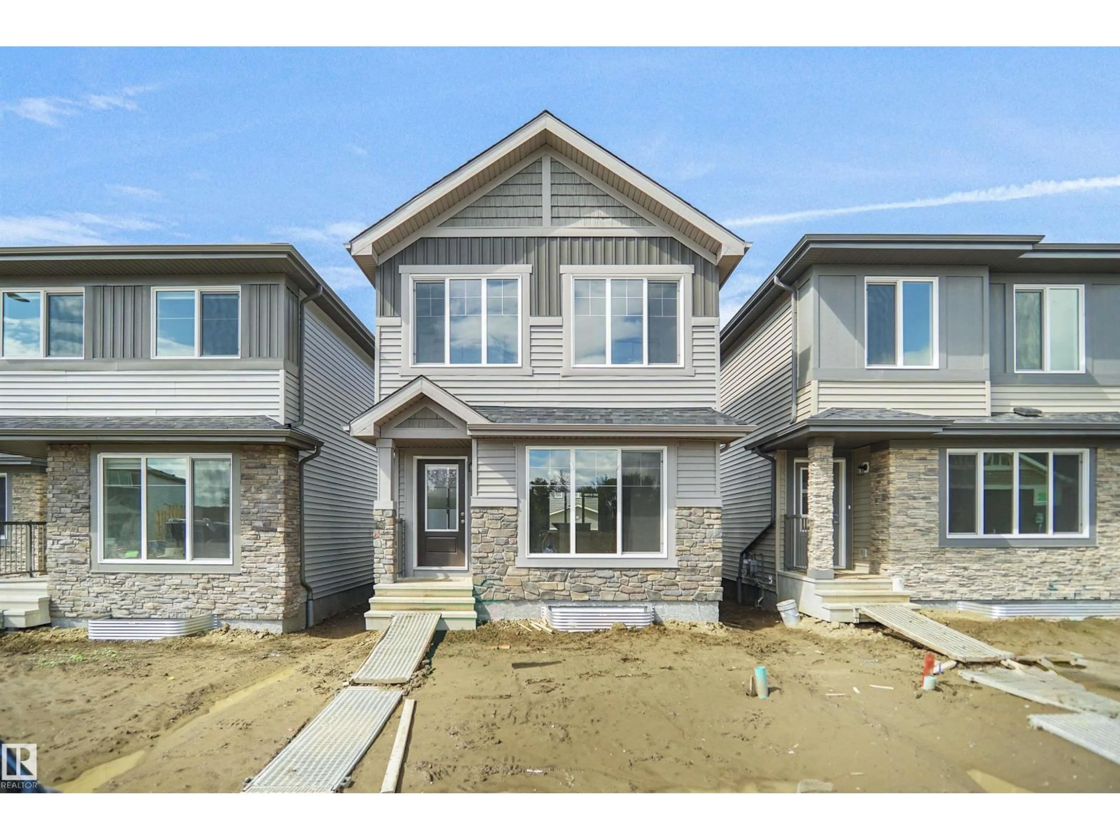 Home with brick exterior material, street for NW - 21223 25 AV, Edmonton Alberta T5Y4G2
