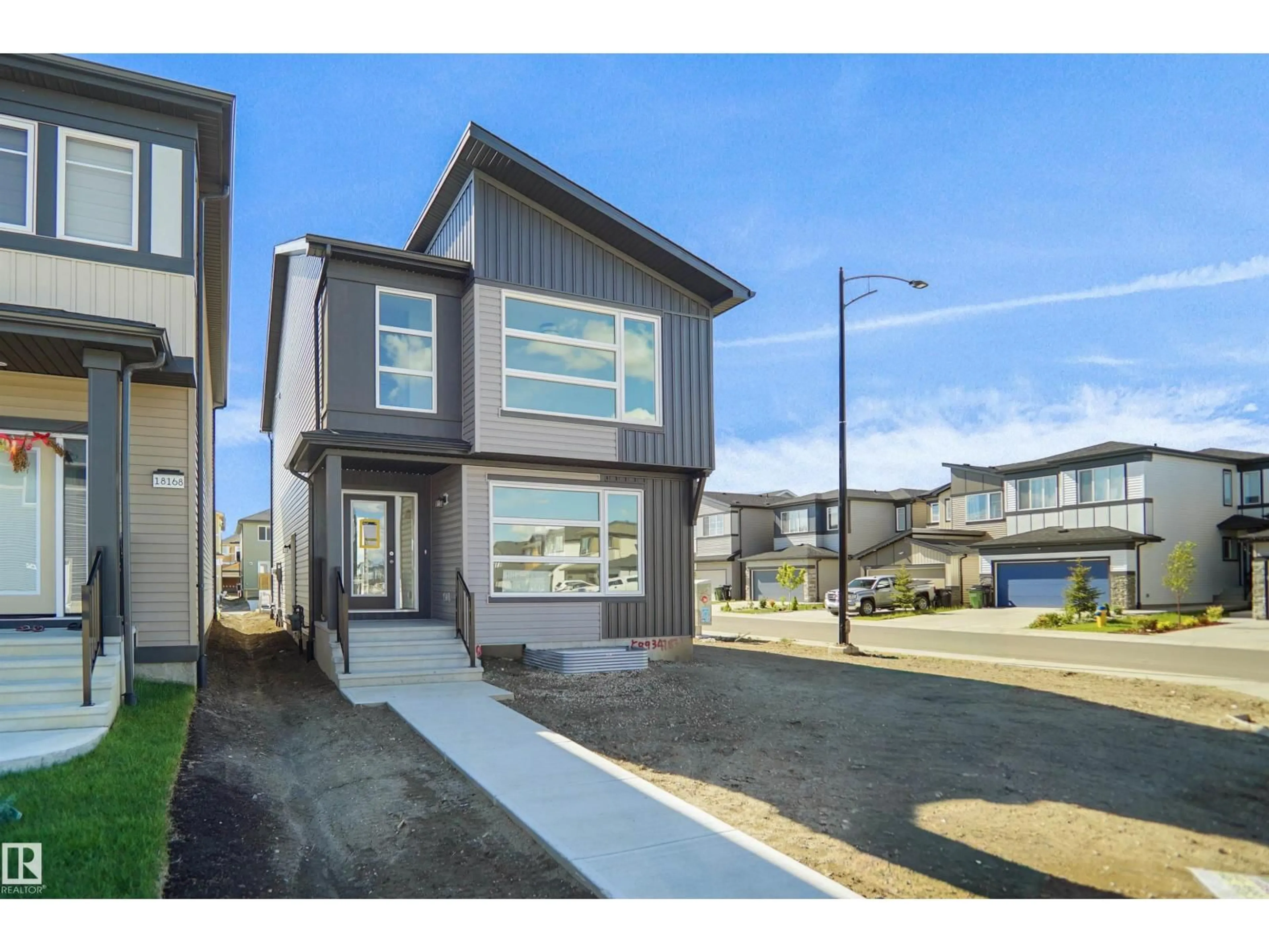 Home with vinyl exterior material, street for 1004 14 AV, Edmonton Alberta T6T2X1