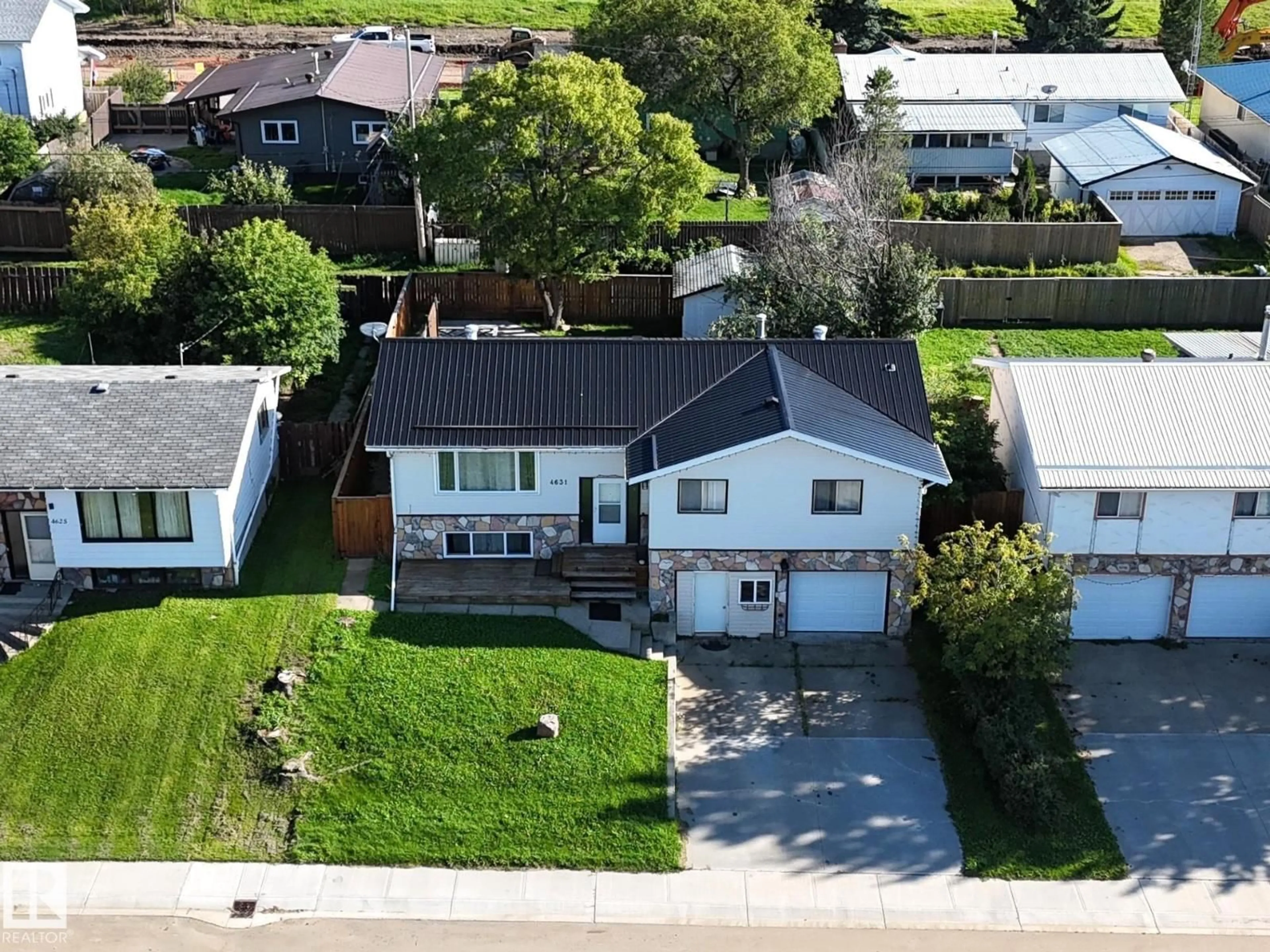 A pic from outside/outdoor area/front of a property/back of a property/a pic from drone, street for 4631 47 AV, Evansburg Alberta T0E0T0