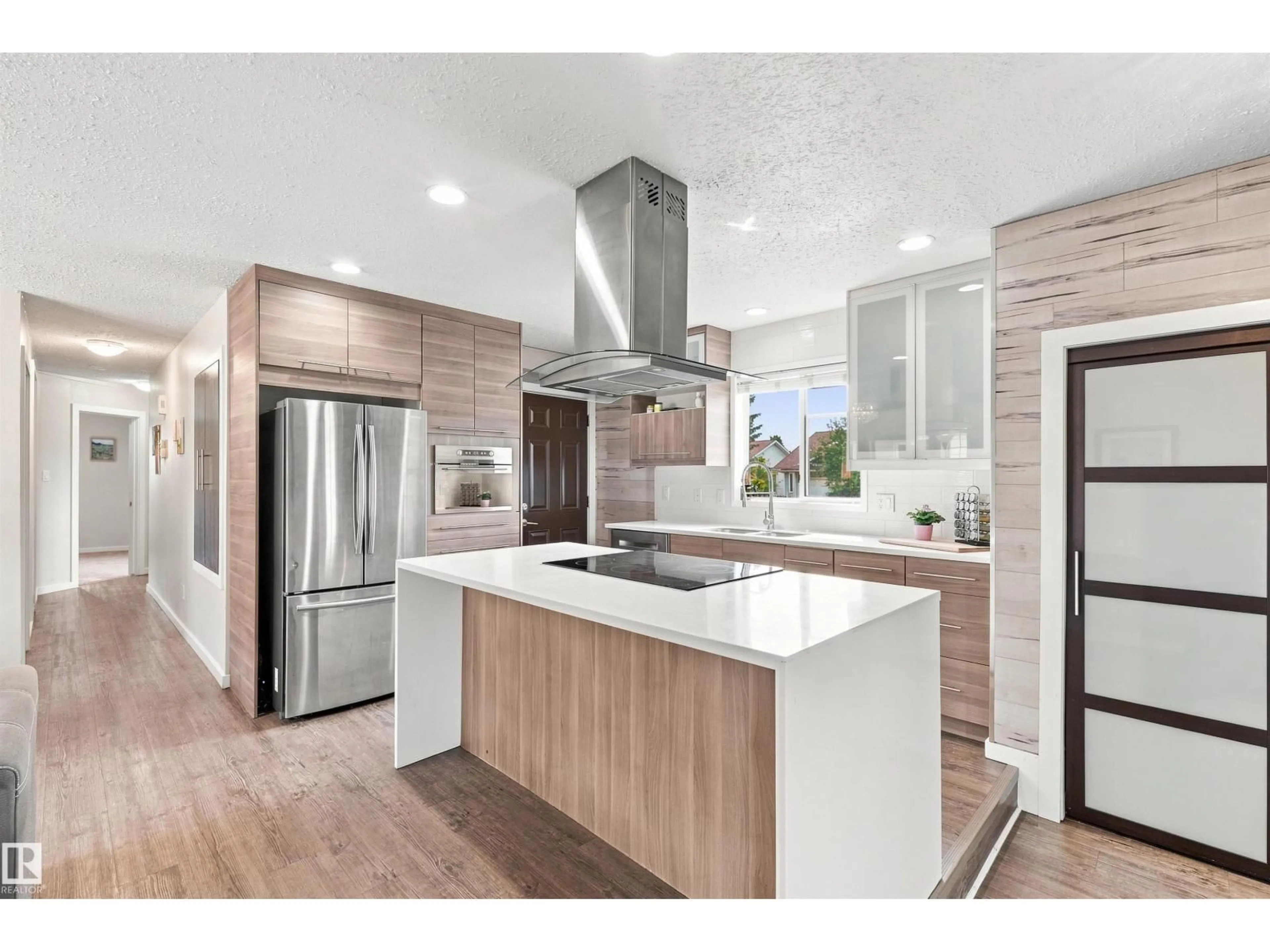 Open concept kitchen, wood/laminate floor for 7407 187 ST, Edmonton Alberta T5T5W4