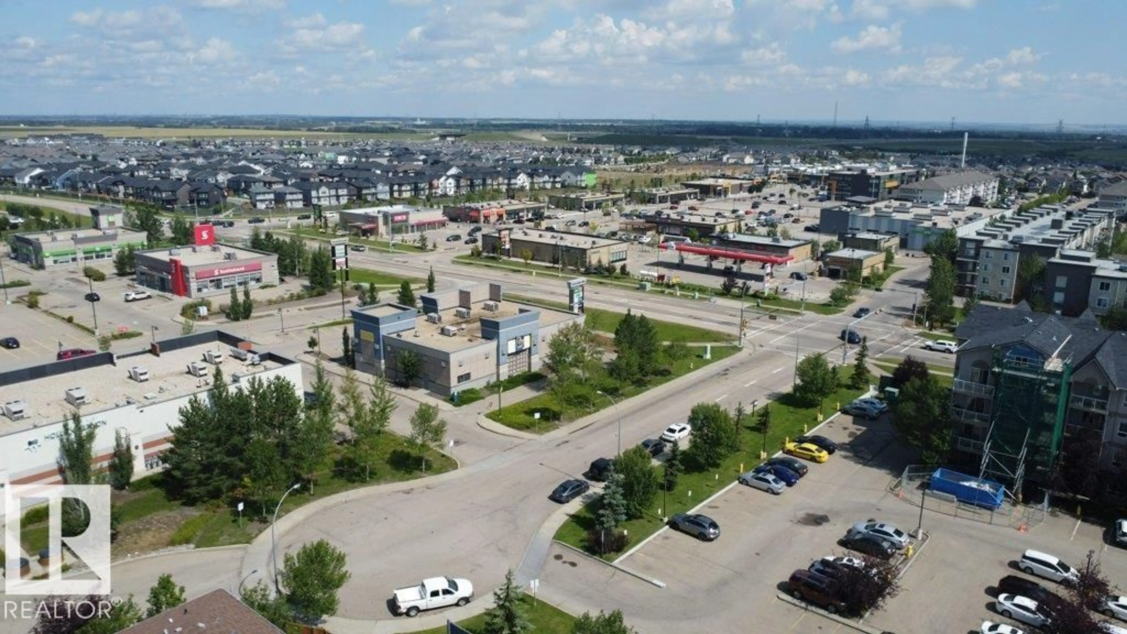 A pic from outside/outdoor area/front of a property/back of a property/a pic from drone, street for NW NW - 317 5005 165 AV, Edmonton Alberta T5Y0L8