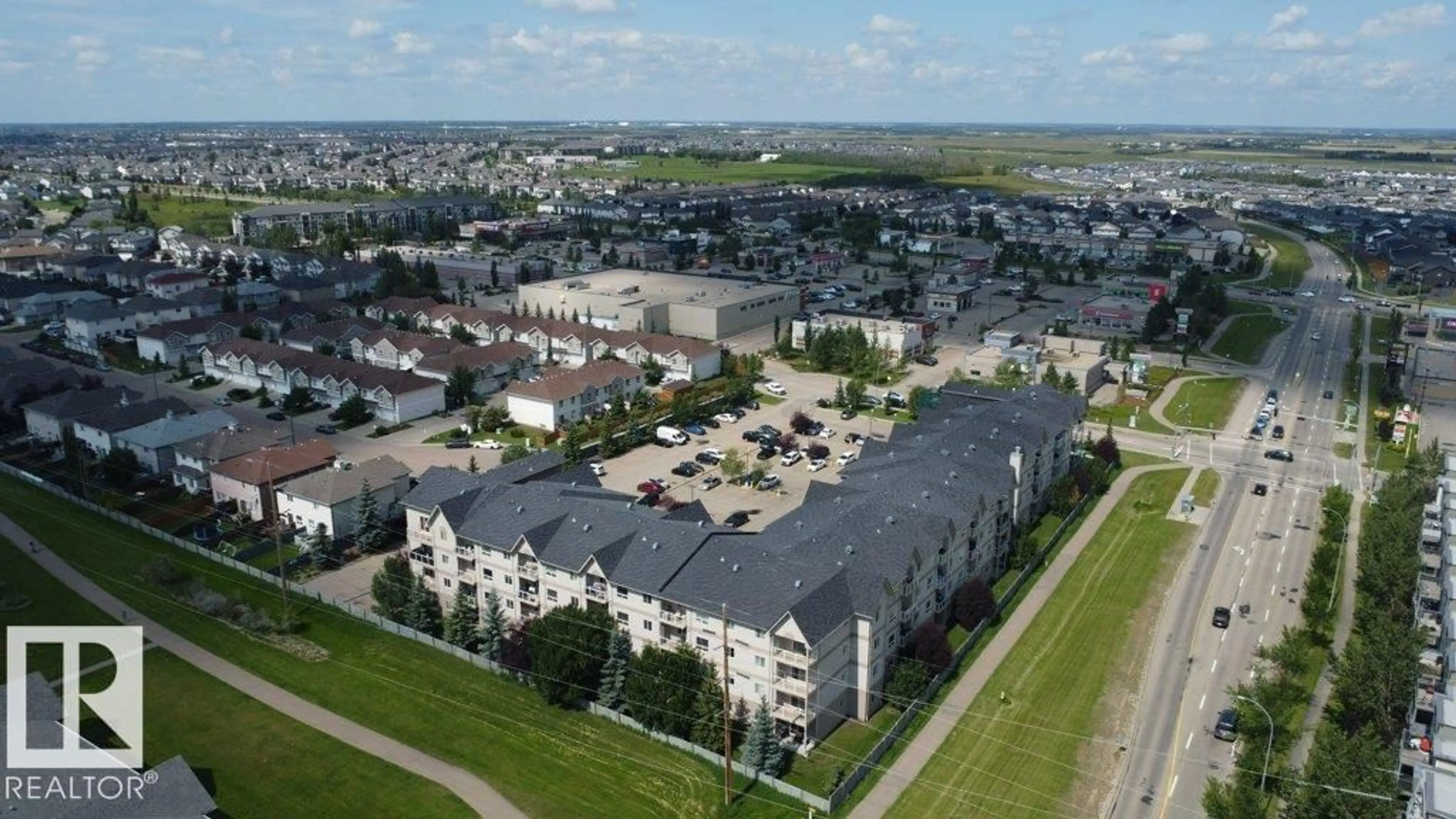 A pic from outside/outdoor area/front of a property/back of a property/a pic from drone, unknown for NW NW - 317 5005 165 AV, Edmonton Alberta T5Y0L8